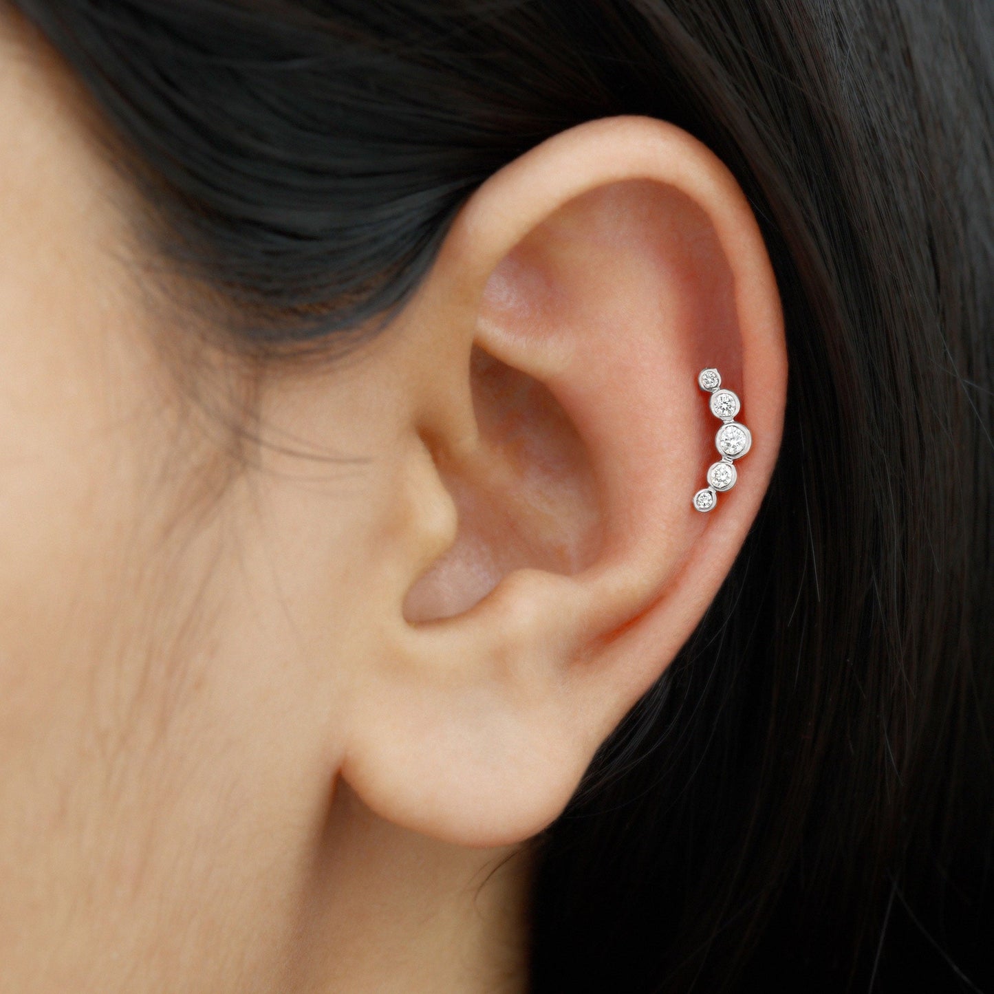 Bezel Set Moissanite Curved Helix Earring in Graduated Style