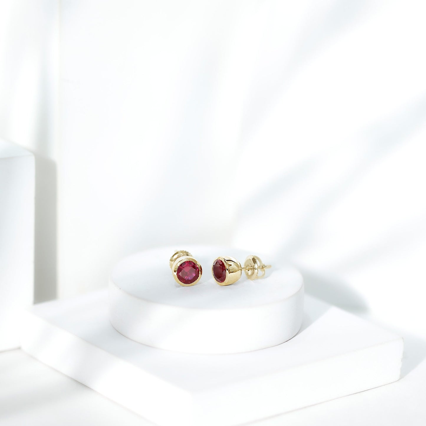 Lab Grown Ruby Solitaire Stud Earrings in Bezel Setting
