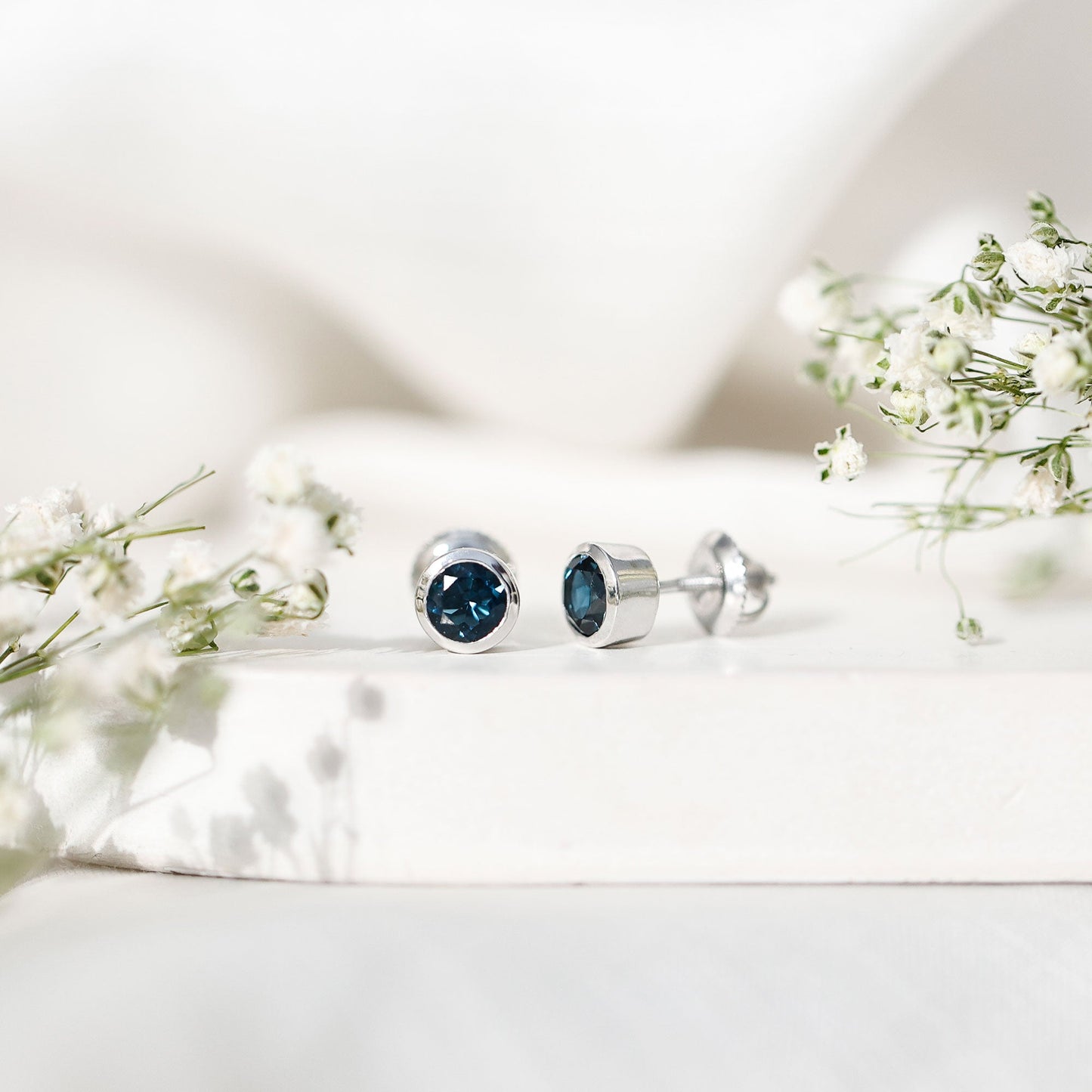 1.2 Carat Round Cut London Blue Topaz Solitaire Stud Earrings in Bezel Setting