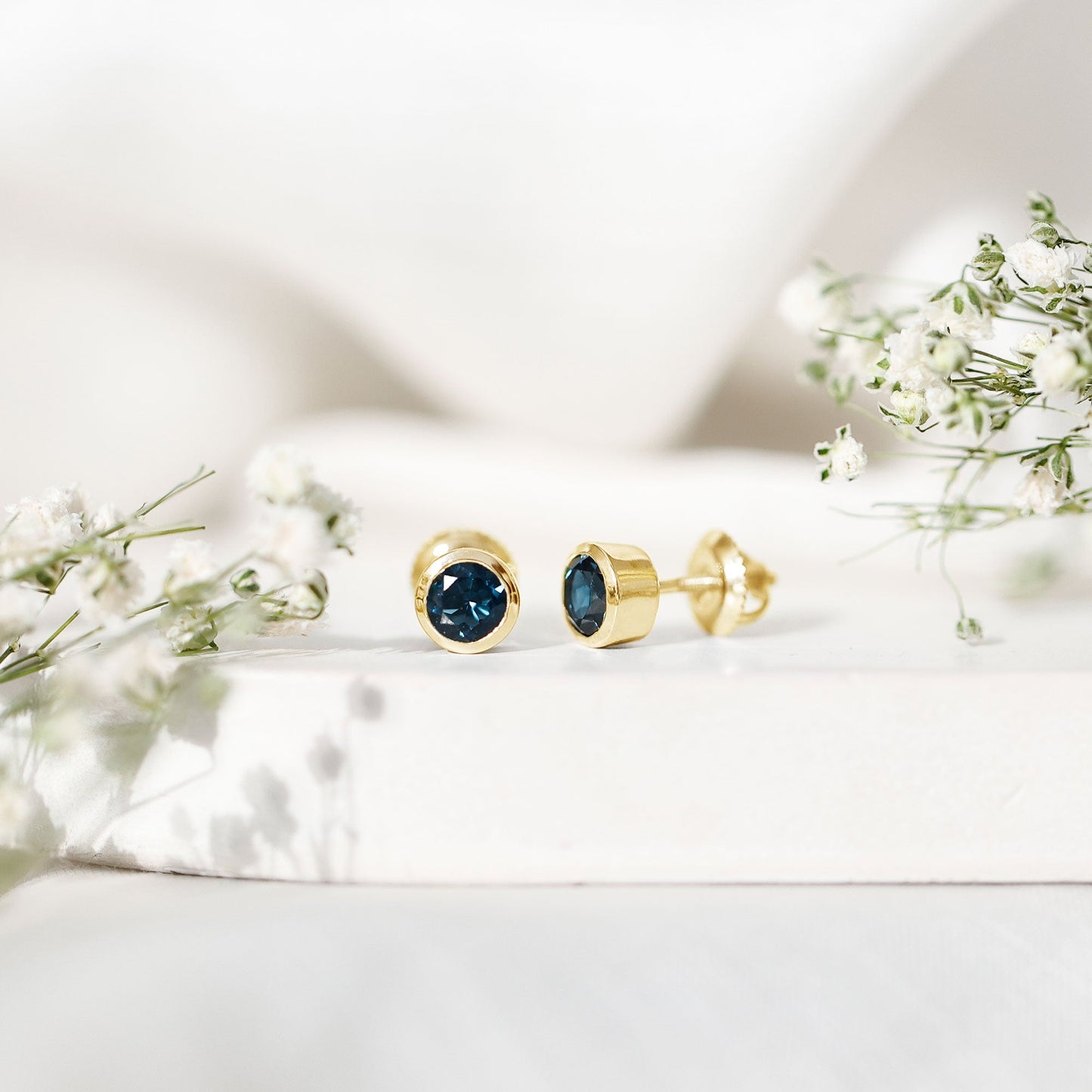 1.2 Carat Round Cut London Blue Topaz Solitaire Stud Earrings in Bezel Setting