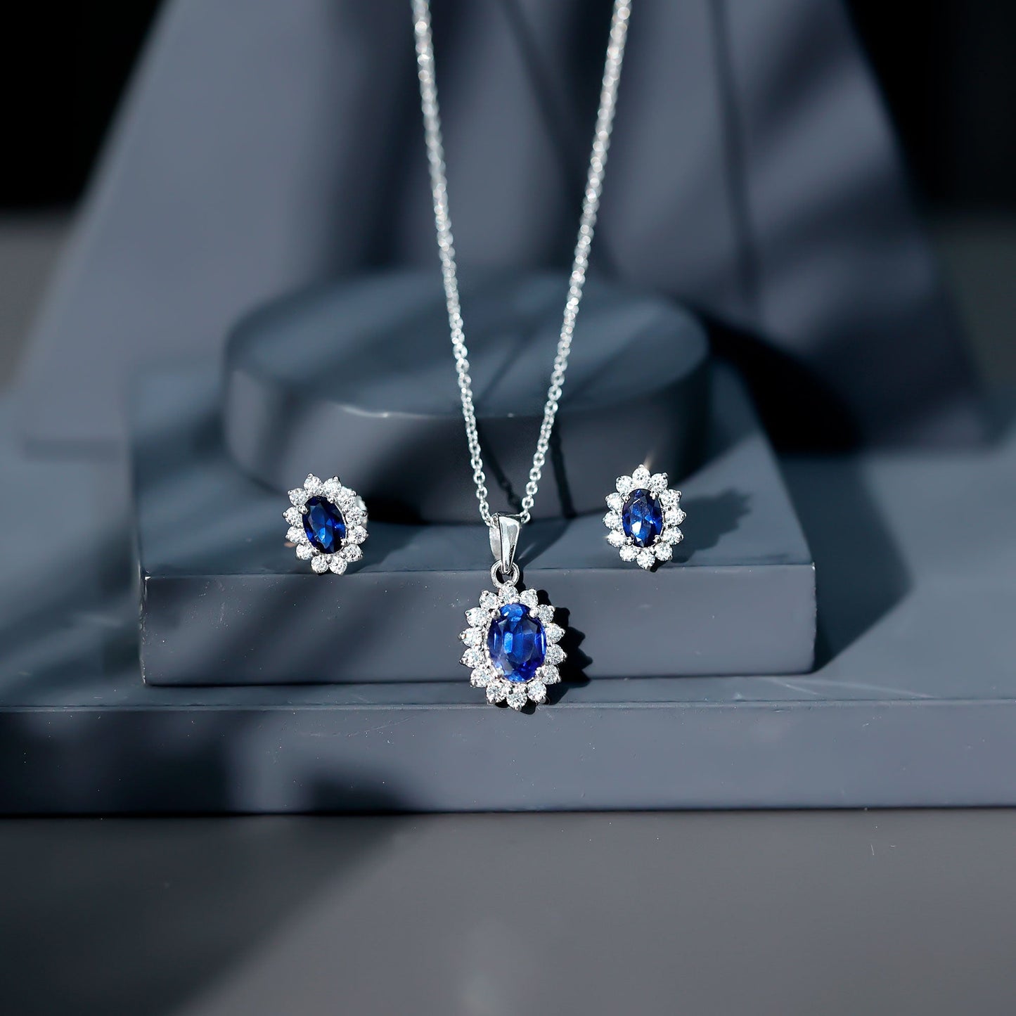 Oval Shaped Lab Created Blue Sapphire Necklace and Earrings Set with Moissanite Halo