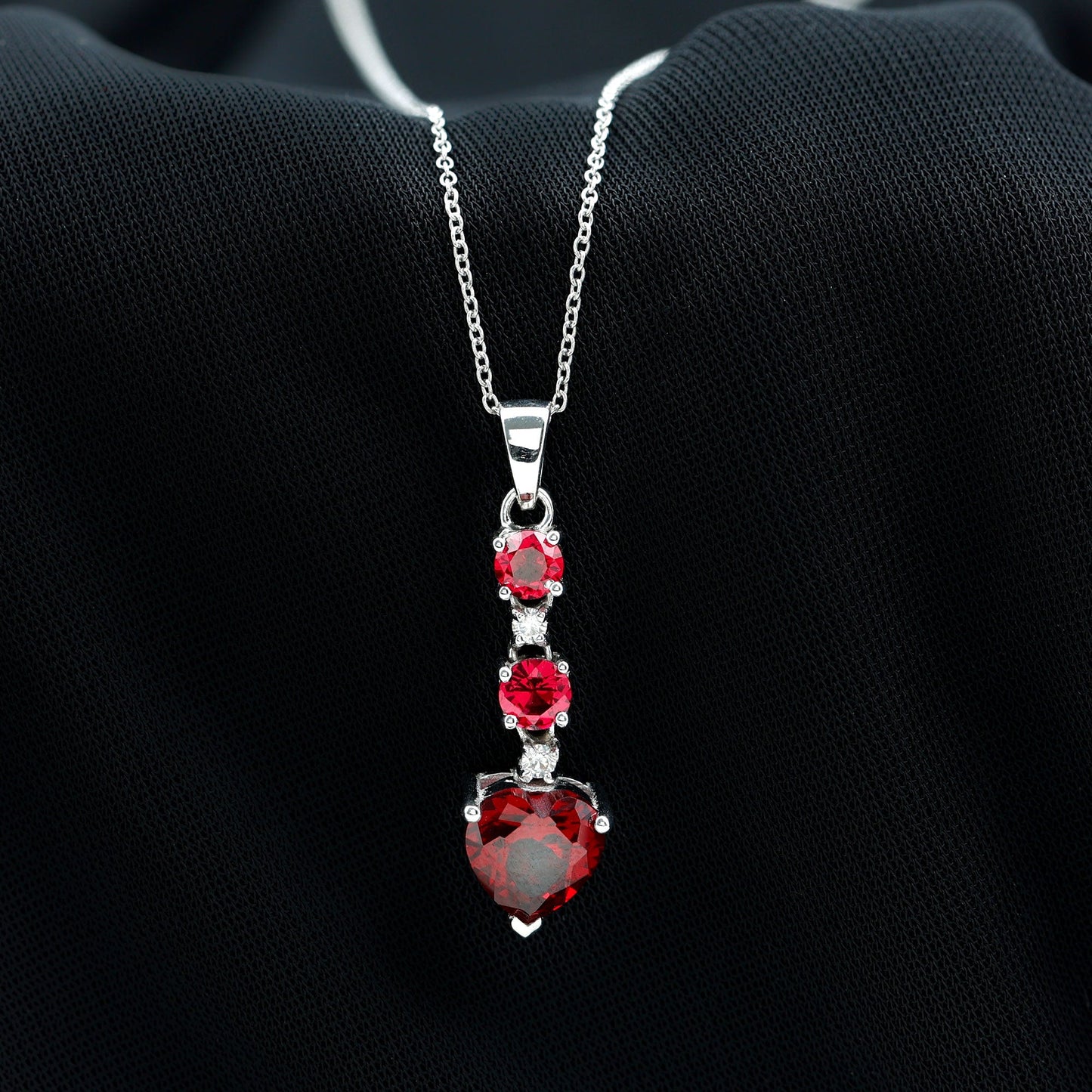 Created Ruby and Moissanite Heart Dangle Pendant Necklace