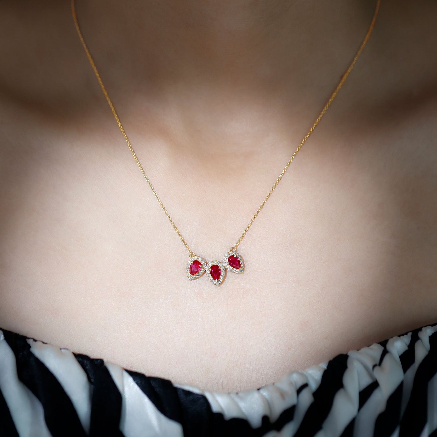 Pear Cut Lab Created Ruby Three Stone Necklace with Moissanite Halo