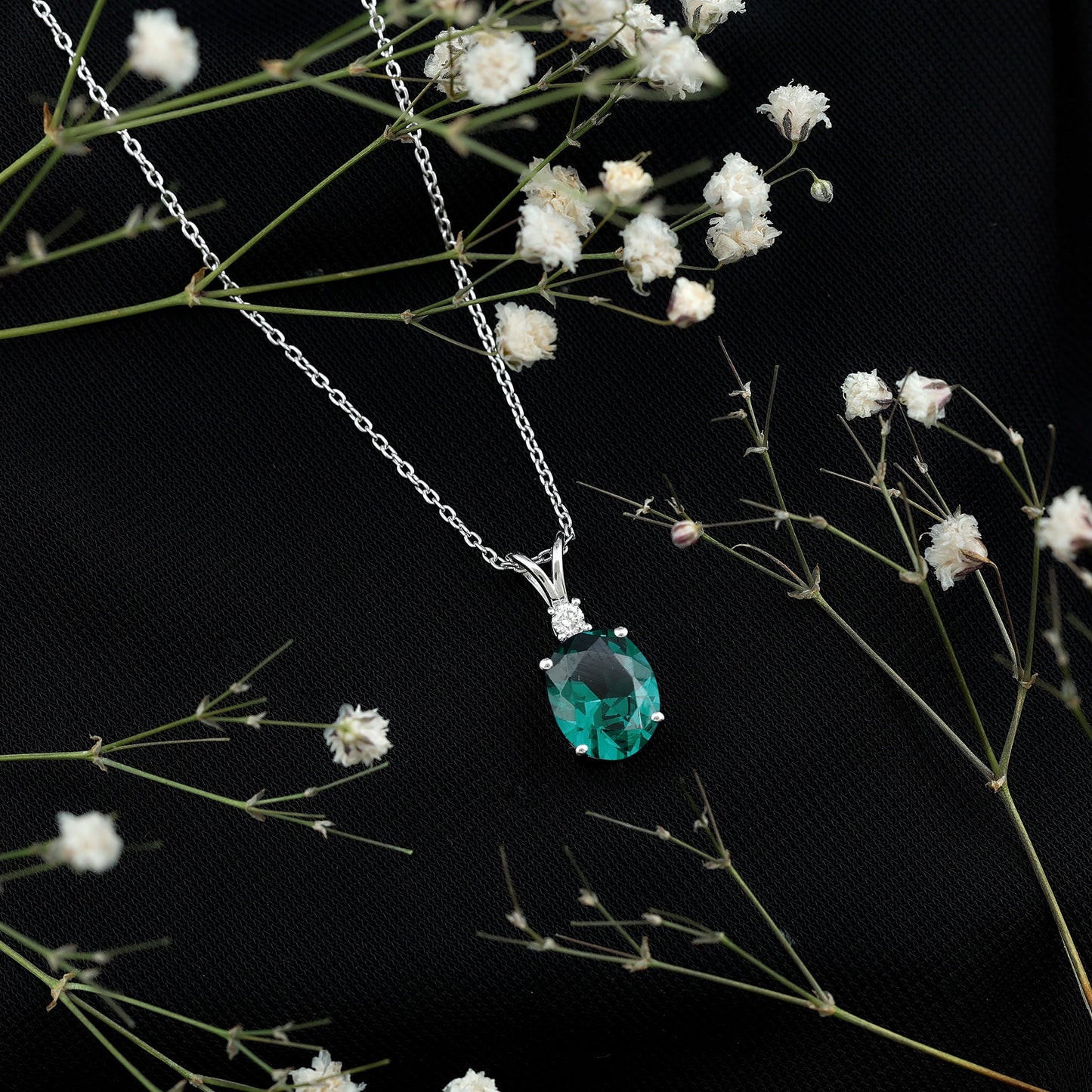 Oval Created Emerald and Moissanite Solitaire Pendant