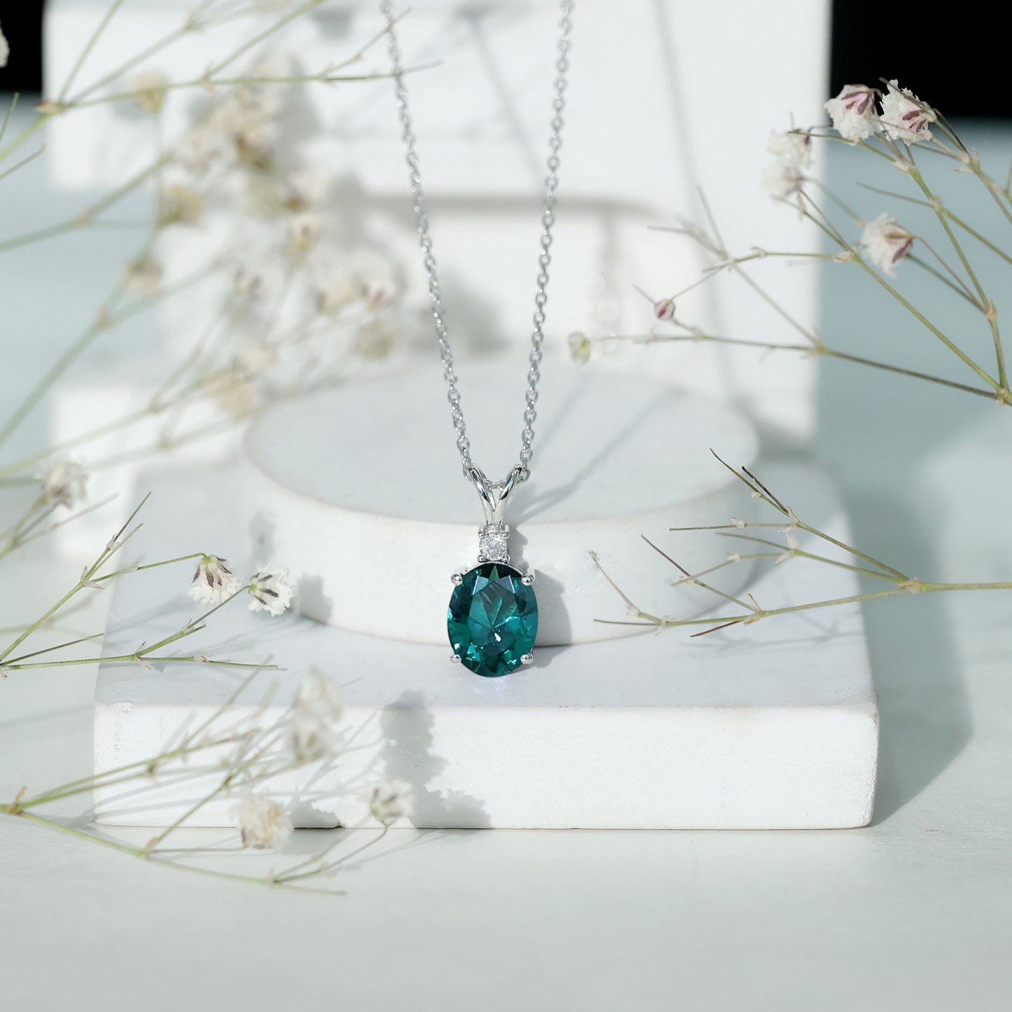 Oval Created Emerald and Moissanite Solitaire Pendant