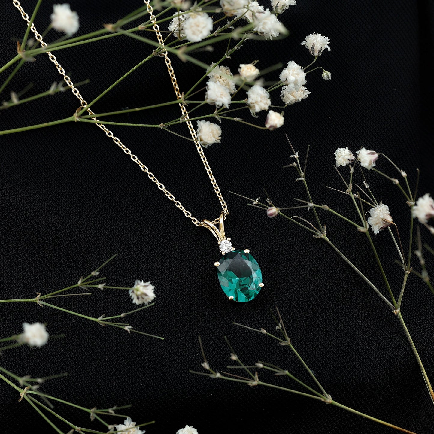 Oval Created Emerald and Moissanite Solitaire Pendant