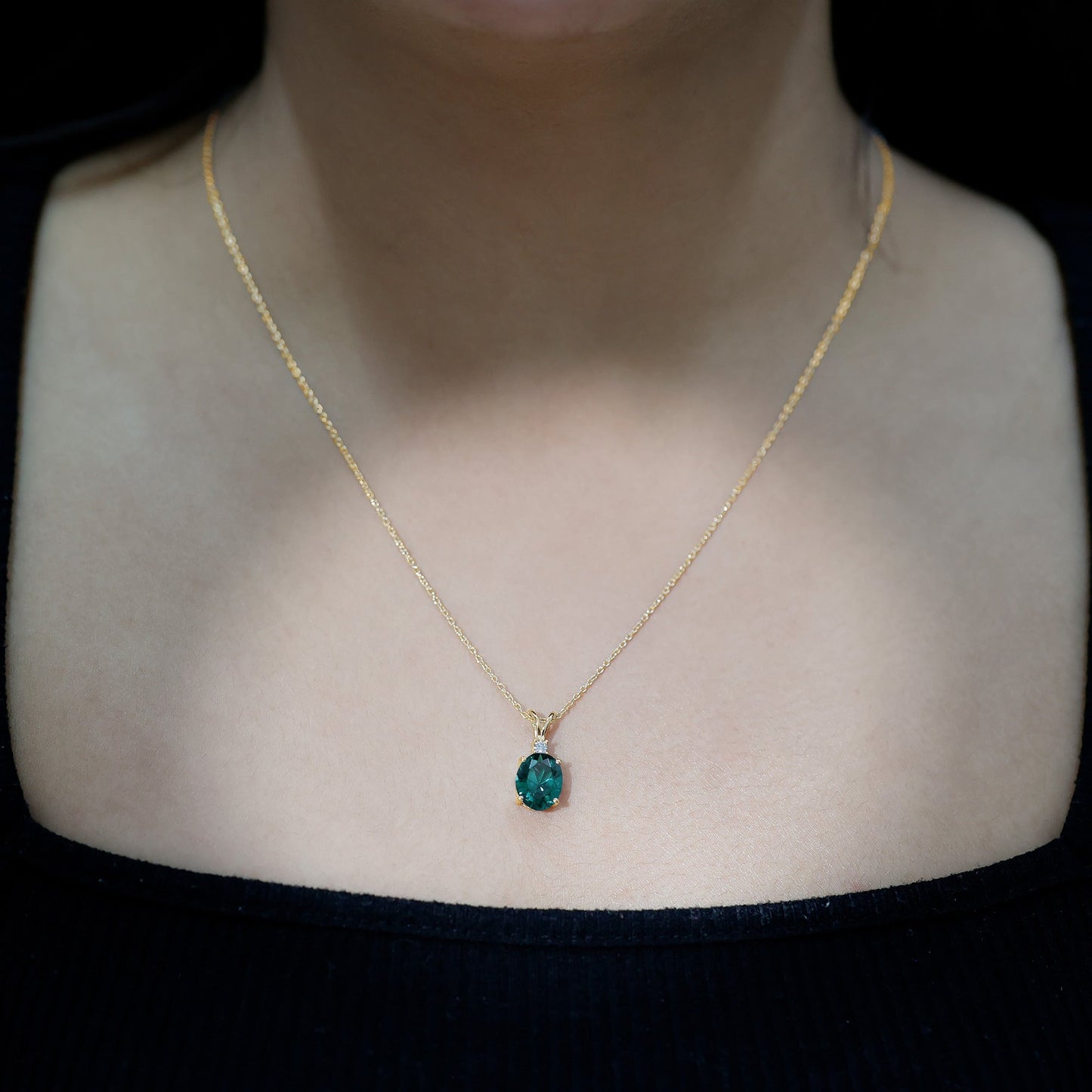Oval Created Emerald and Moissanite Solitaire Pendant