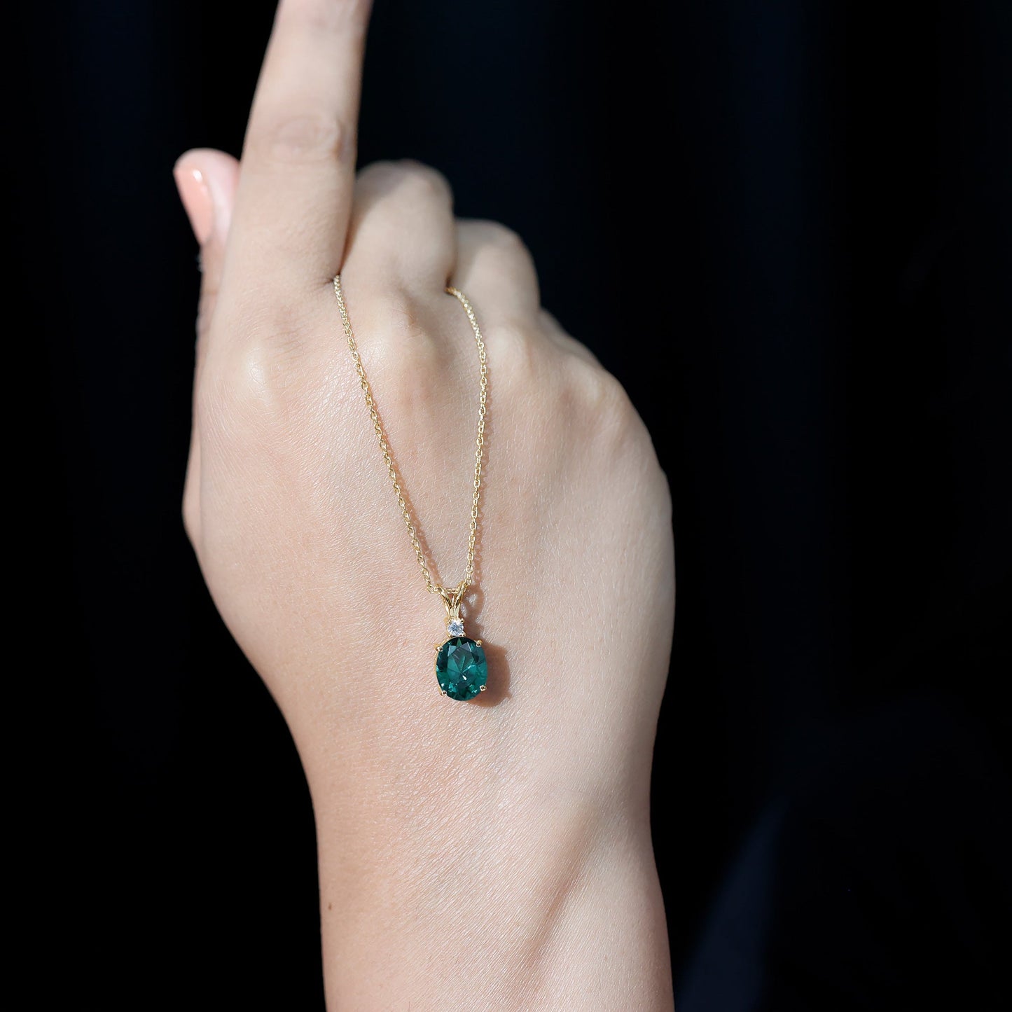 Oval Created Emerald and Moissanite Solitaire Pendant