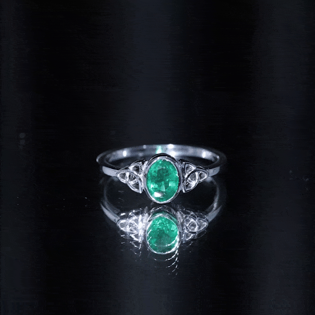 Oval Shaped Emerald Celtic Engagement Ring in Bezel Setting