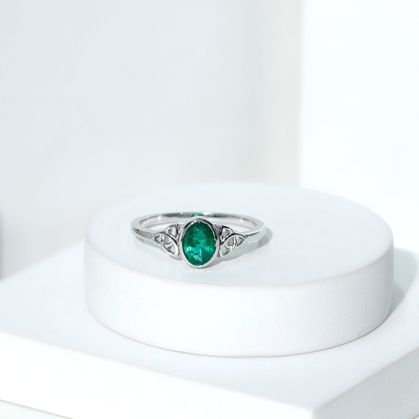 Oval Shaped Emerald Celtic Engagement Ring in Bezel Setting