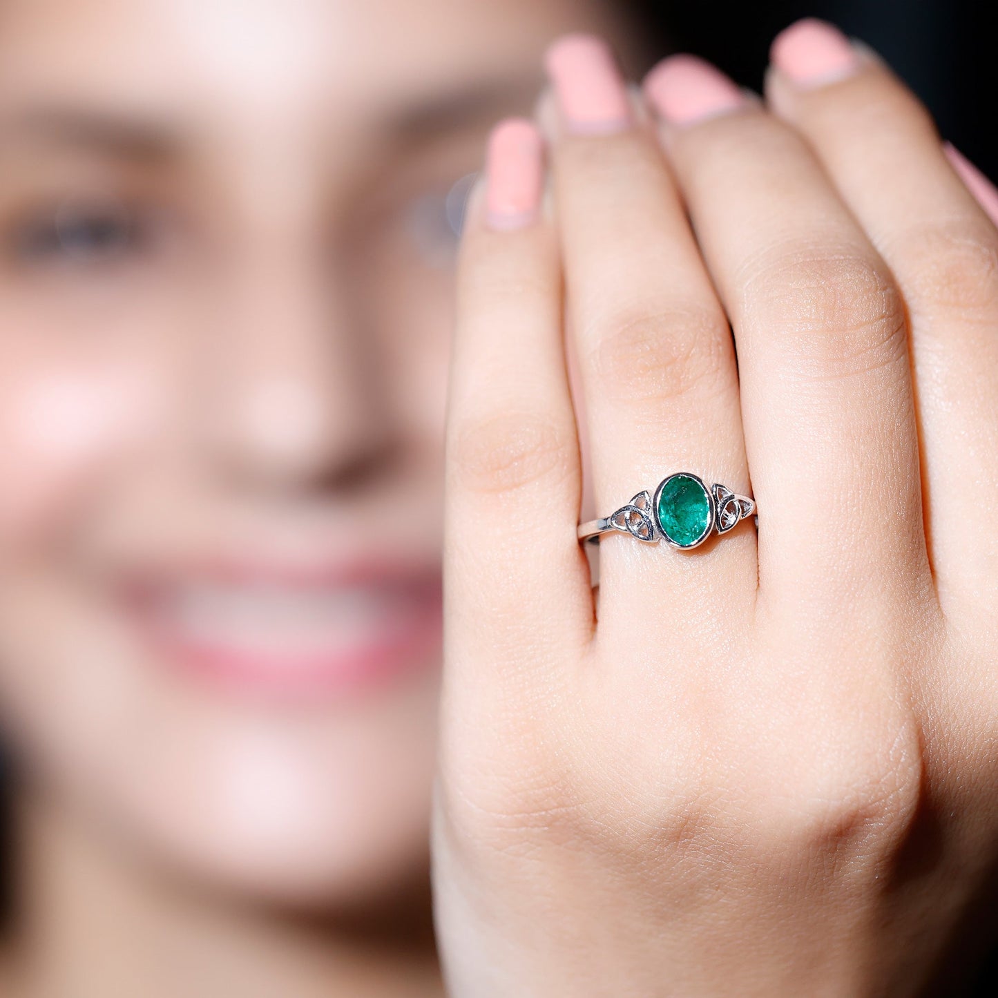 Oval Shaped Emerald Celtic Engagement Ring in Bezel Setting