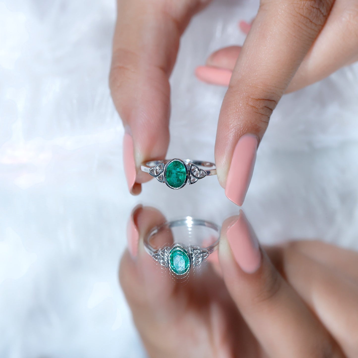 Oval Shaped Emerald Celtic Engagement Ring in Bezel Setting