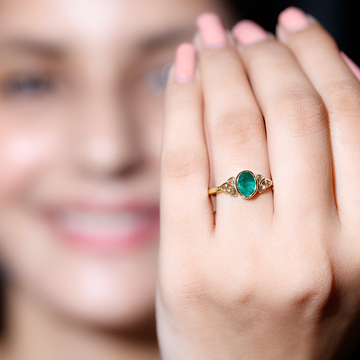 Oval Shaped Emerald Celtic Engagement Ring in Bezel Setting