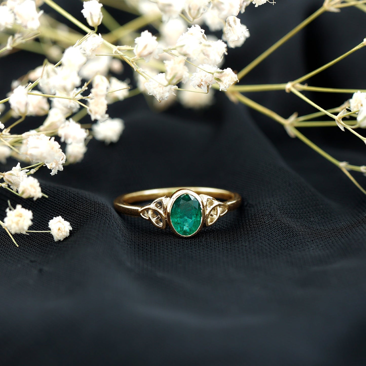 Oval Shaped Emerald Celtic Engagement Ring in Bezel Setting