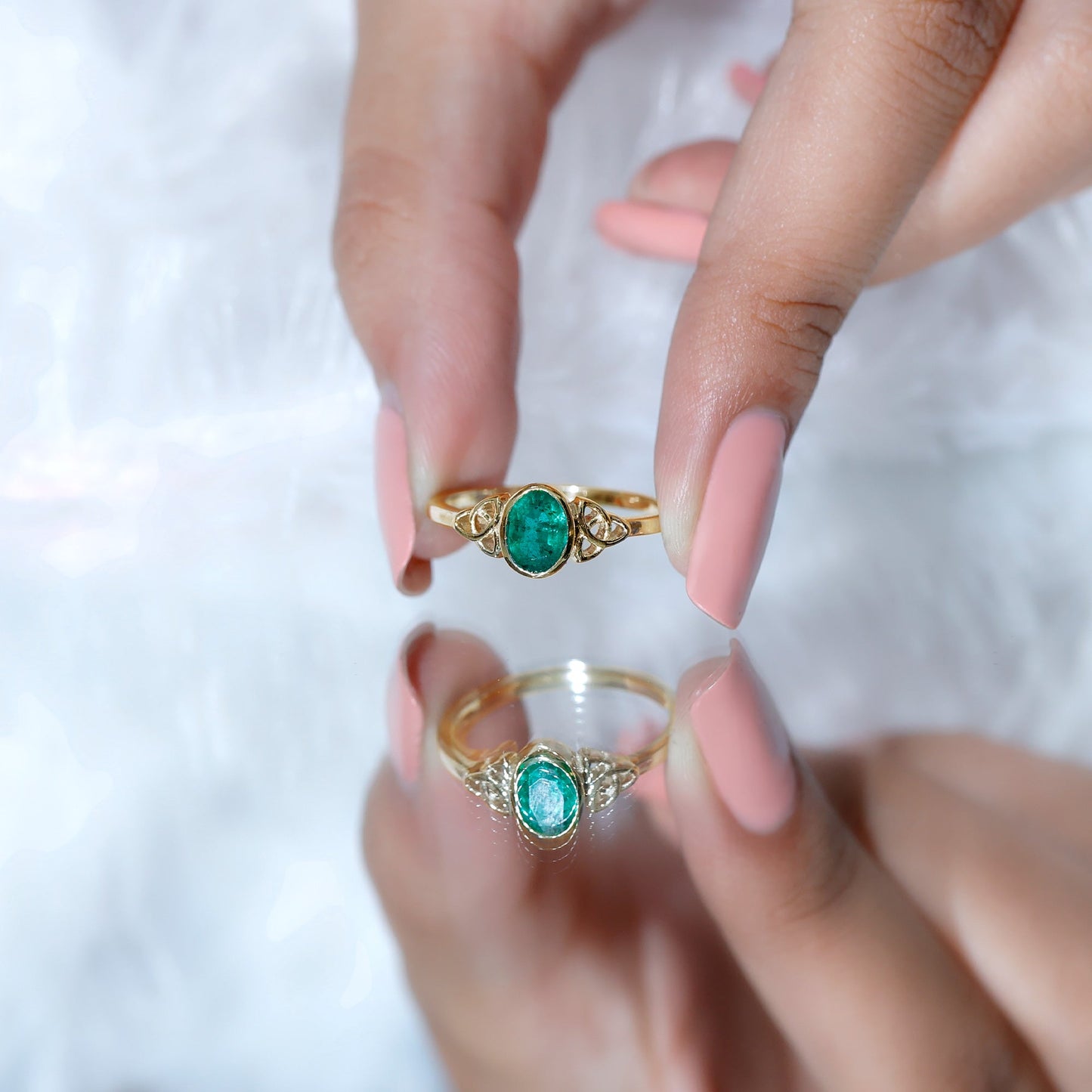 Oval Shaped Emerald Celtic Engagement Ring in Bezel Setting