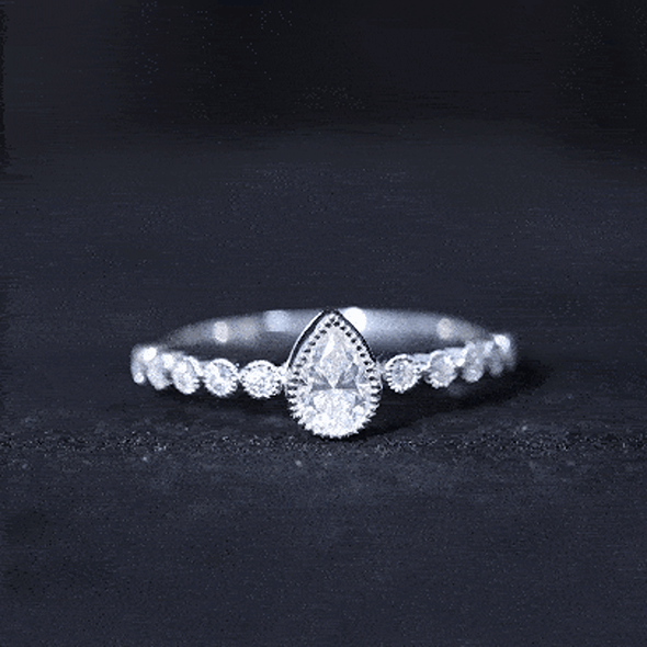 Lab Grown Diamond 0.6 Carat Pear Shaped Engagement Ring With Side Stones