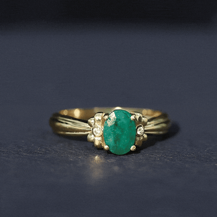 Oval Cut Emerald Solitaire Engagement Ring with Bow Design
