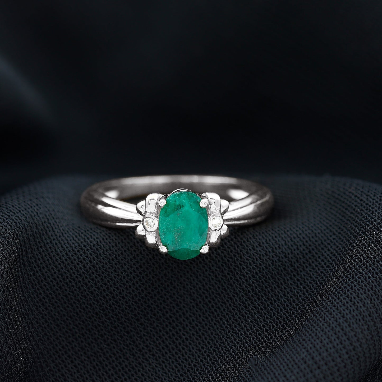 Oval Cut Emerald Solitaire Engagement Ring with Bow Design