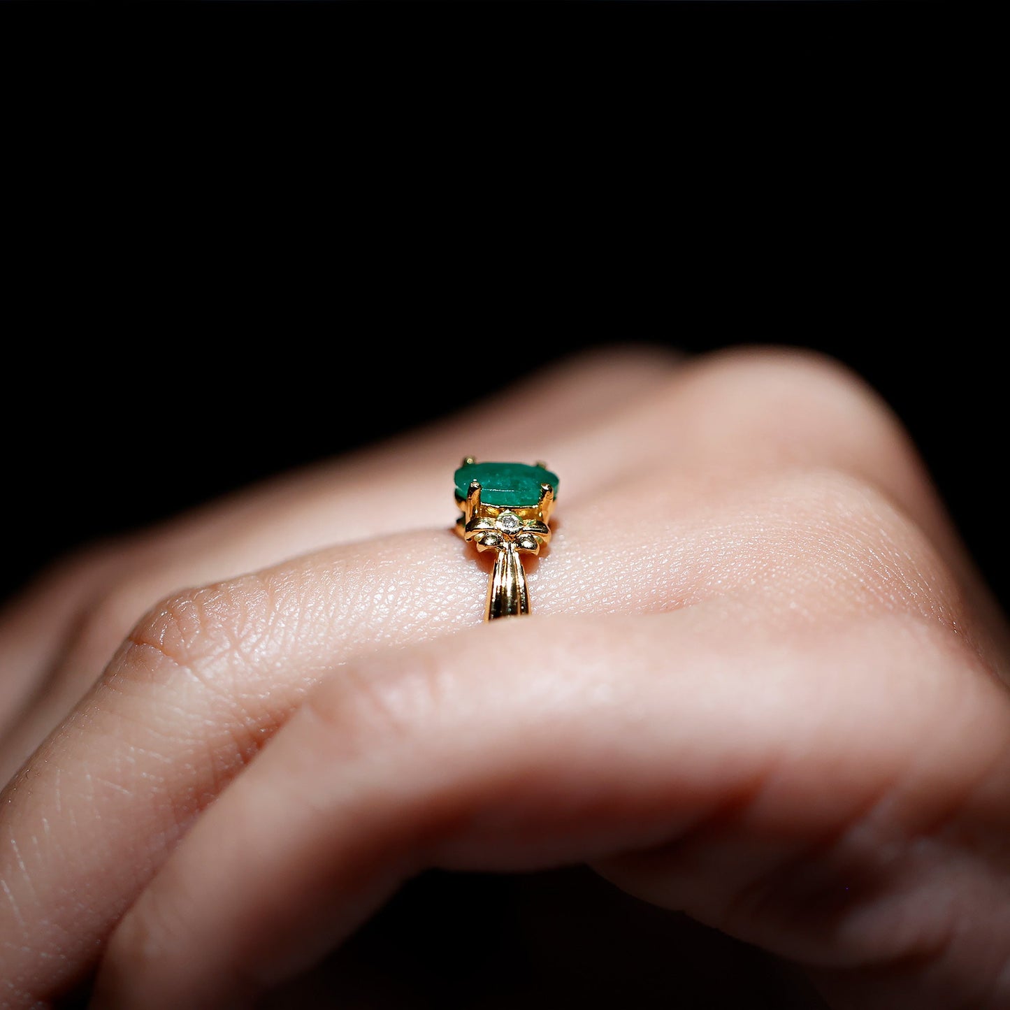 Oval Cut Emerald Solitaire Engagement Ring with Bow Design