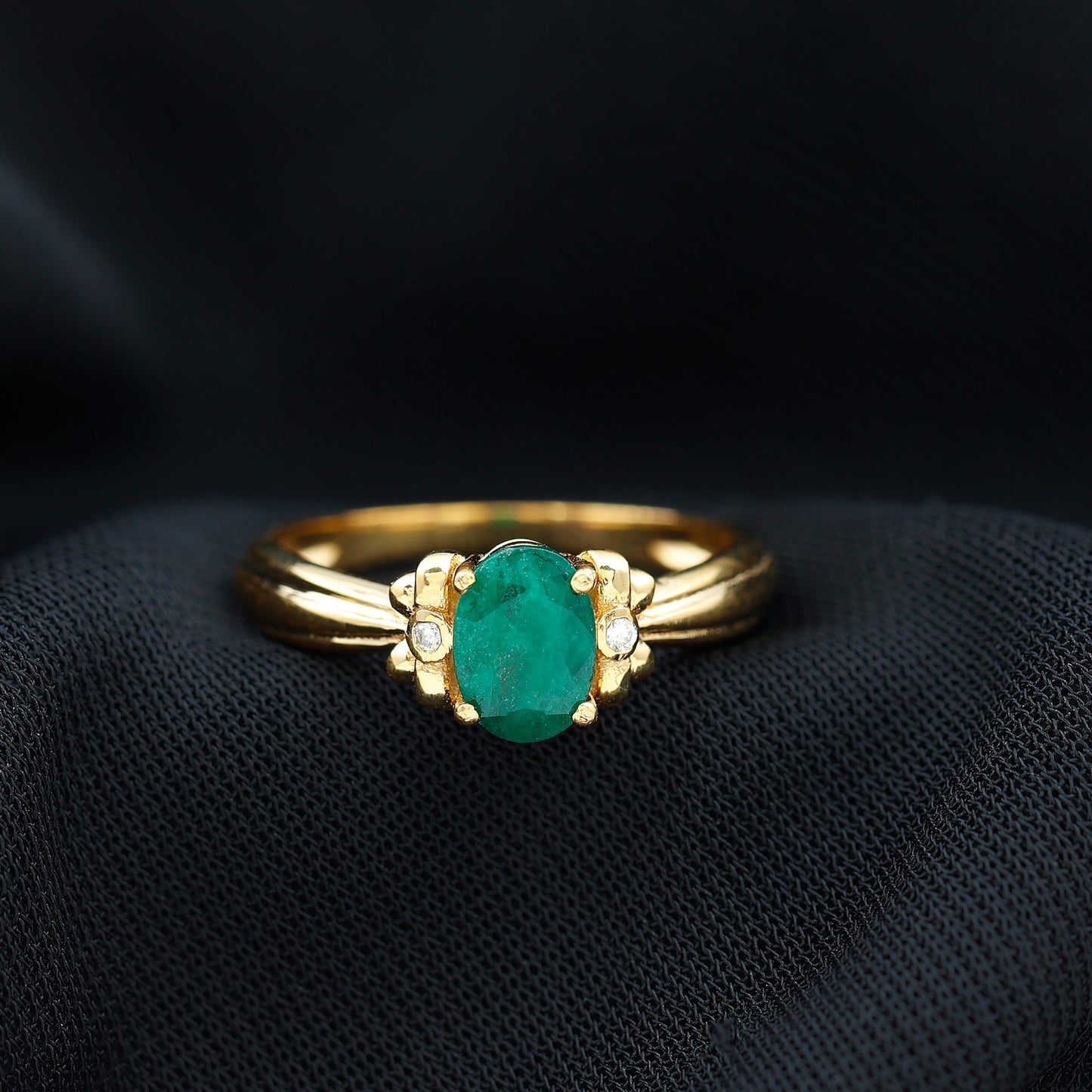 Oval Cut Emerald Solitaire Engagement Ring with Bow Design