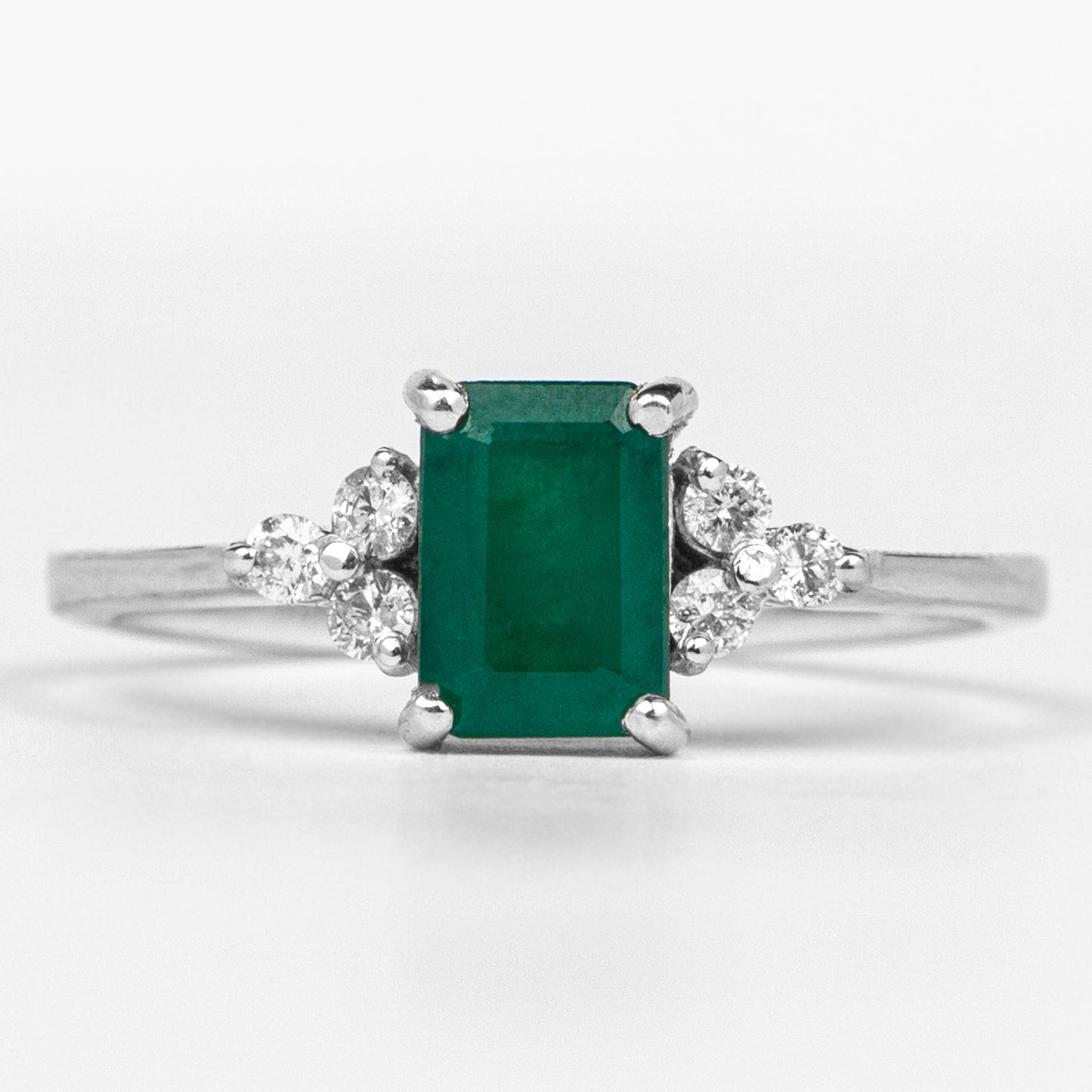 Octagon Cut Emerald Engagement Ring with Diamond Trio
