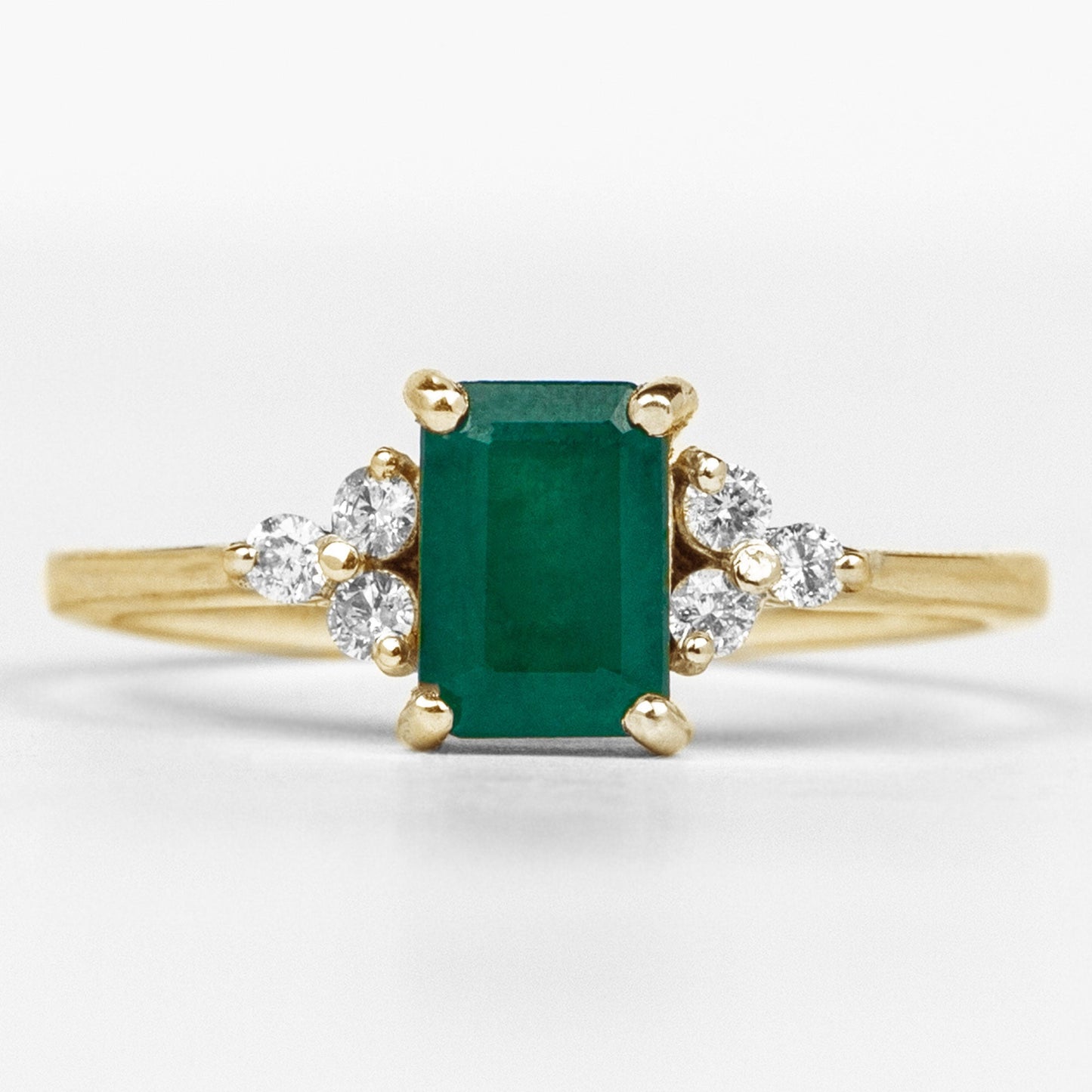 Octagon Cut Emerald Engagement Ring with Diamond Trio