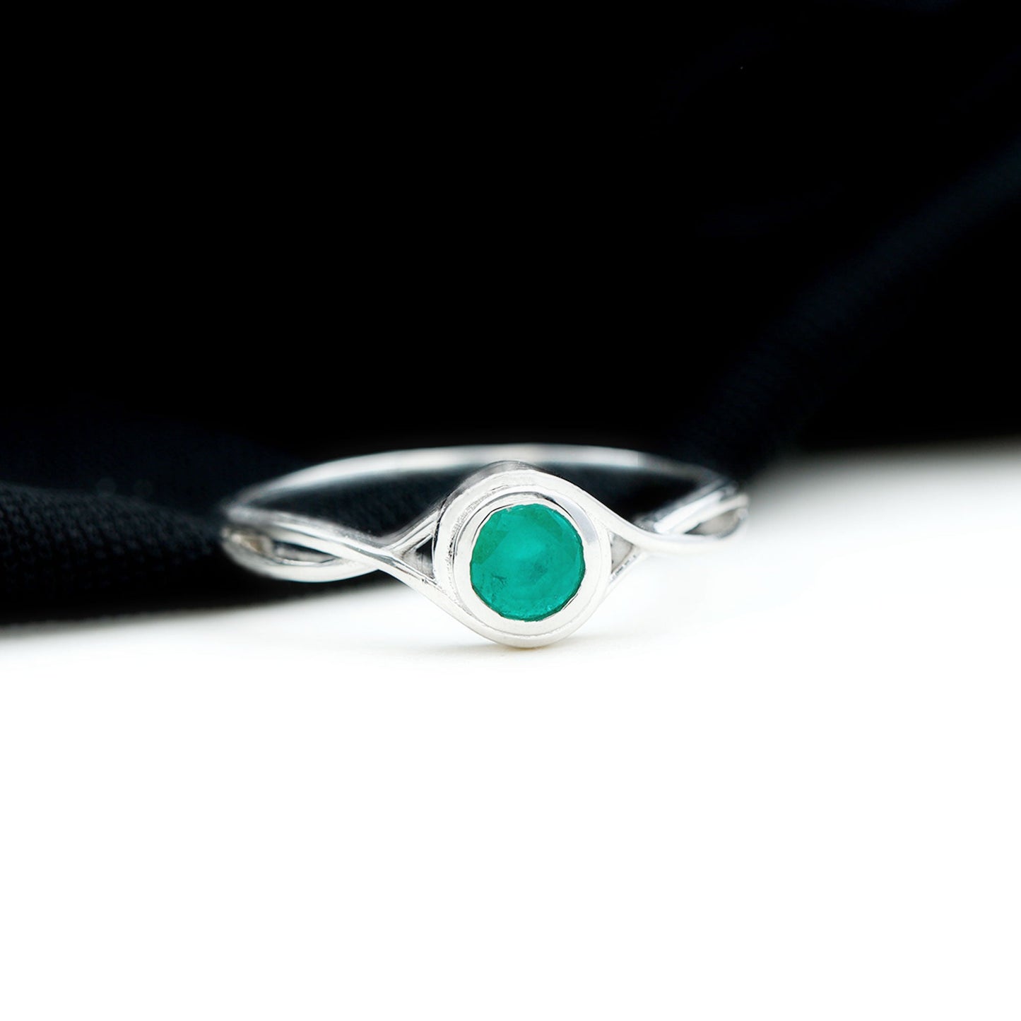 Round Cut Emerald Solitaire Ring with Crossover Band