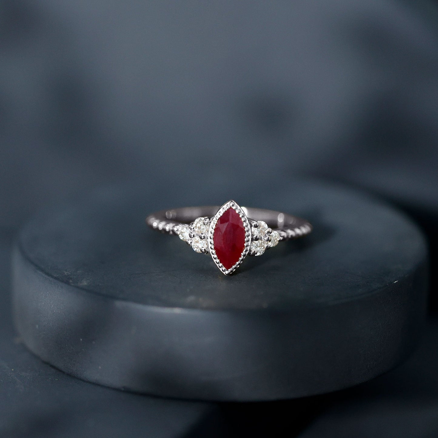 Vintage Style 0.75 Carat Ruby Marquise Engagement Ring with Diamond Trio