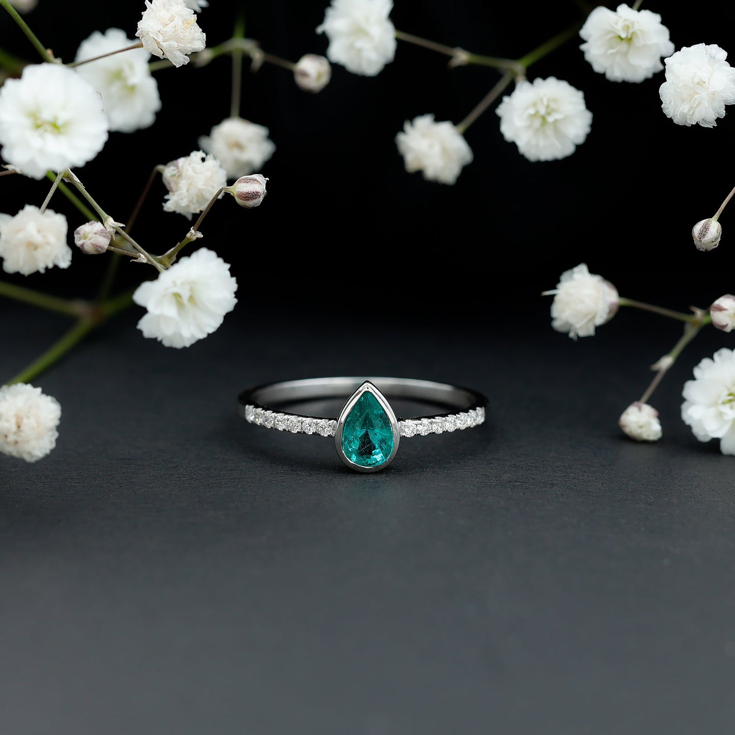 Pear Shaped Emerald Engagement Ring with Diamond Side Stones