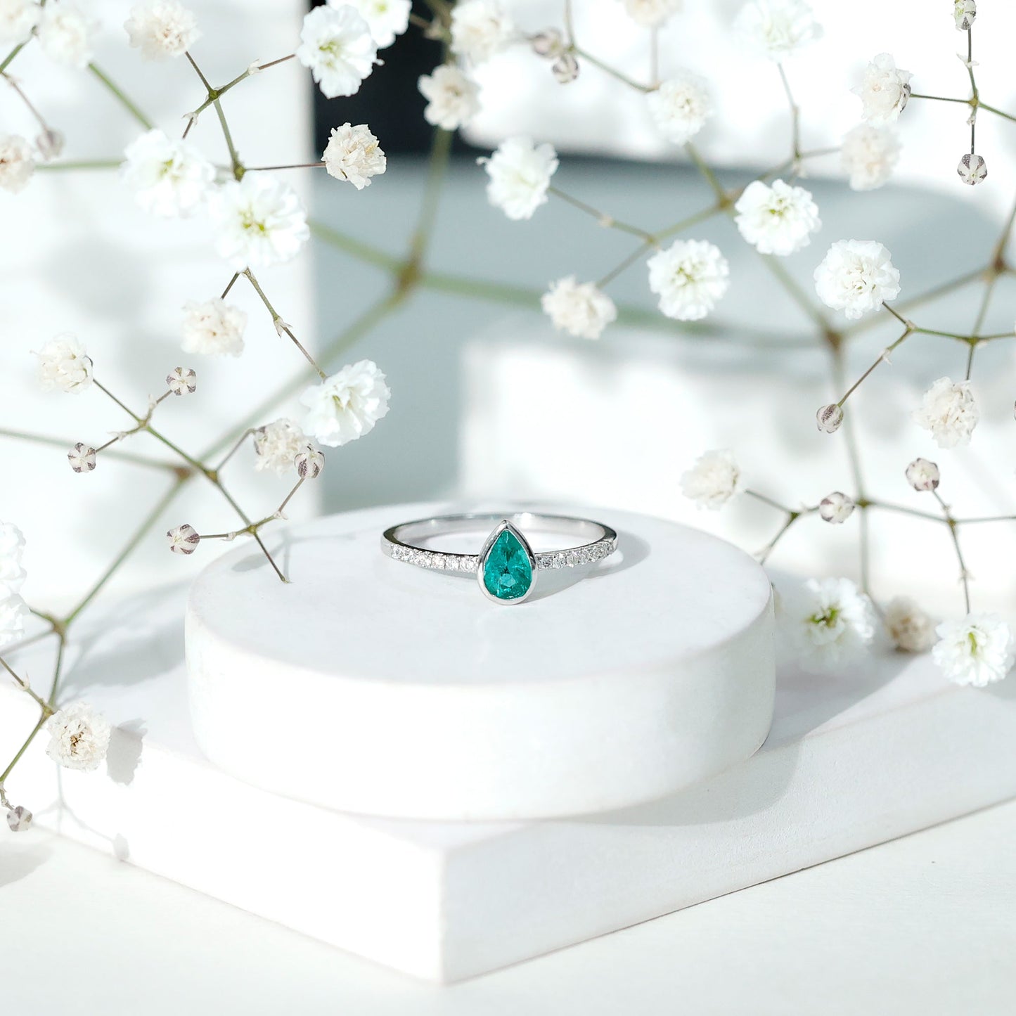 Pear Shaped Emerald Engagement Ring with Diamond Side Stones