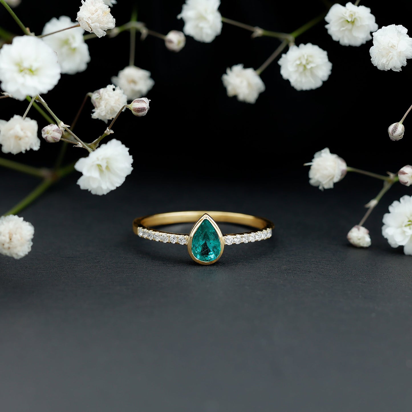 Pear Shaped Emerald Engagement Ring with Diamond Side Stones