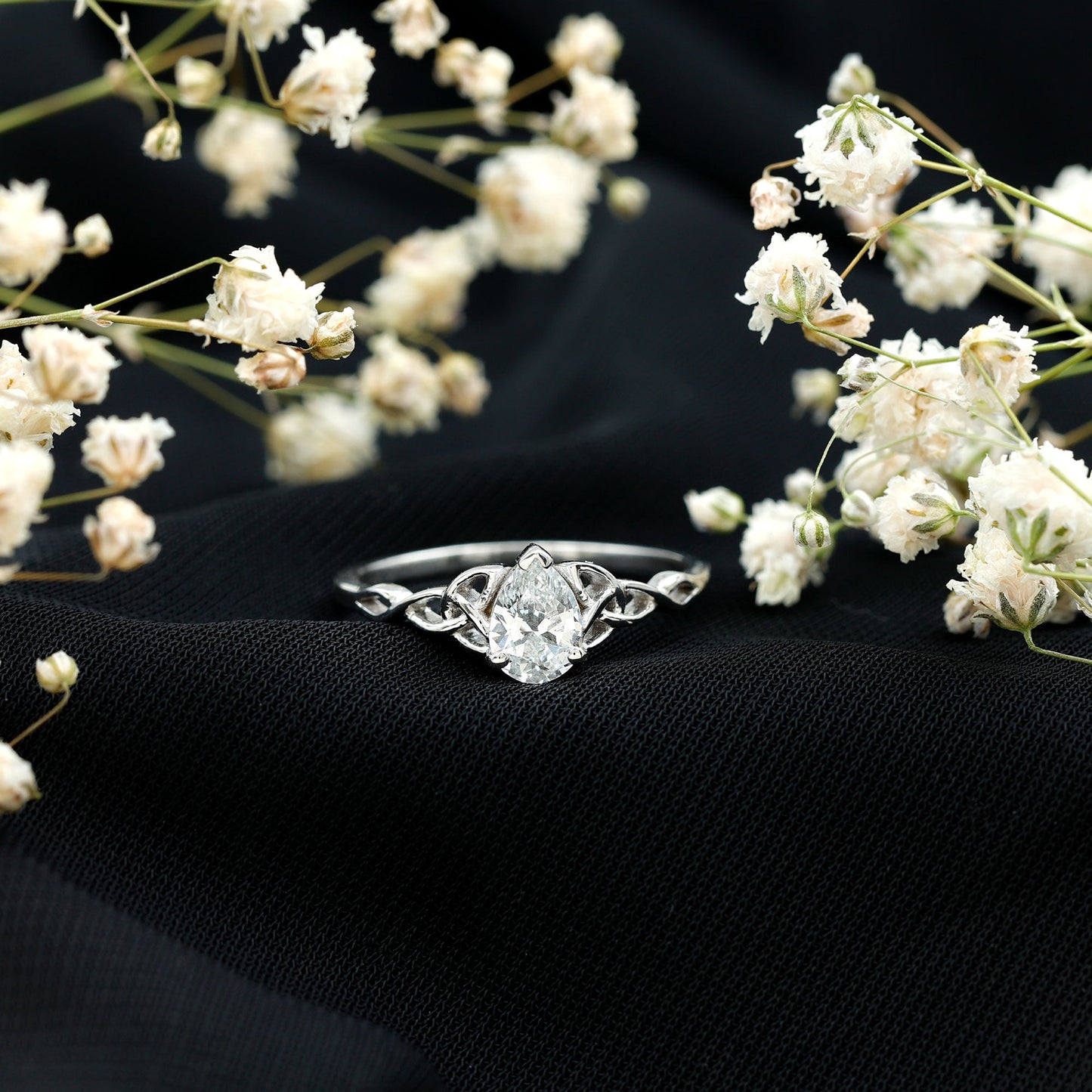 Pear Cut 0.79 Carat Moissanite Celtic Engagement Ring