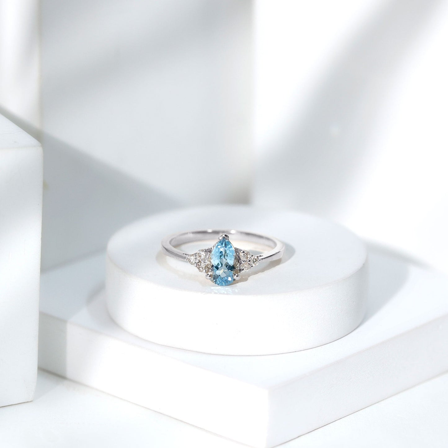 1 Carat Aquamarine Pear Engagement Ring with Diamond Trio