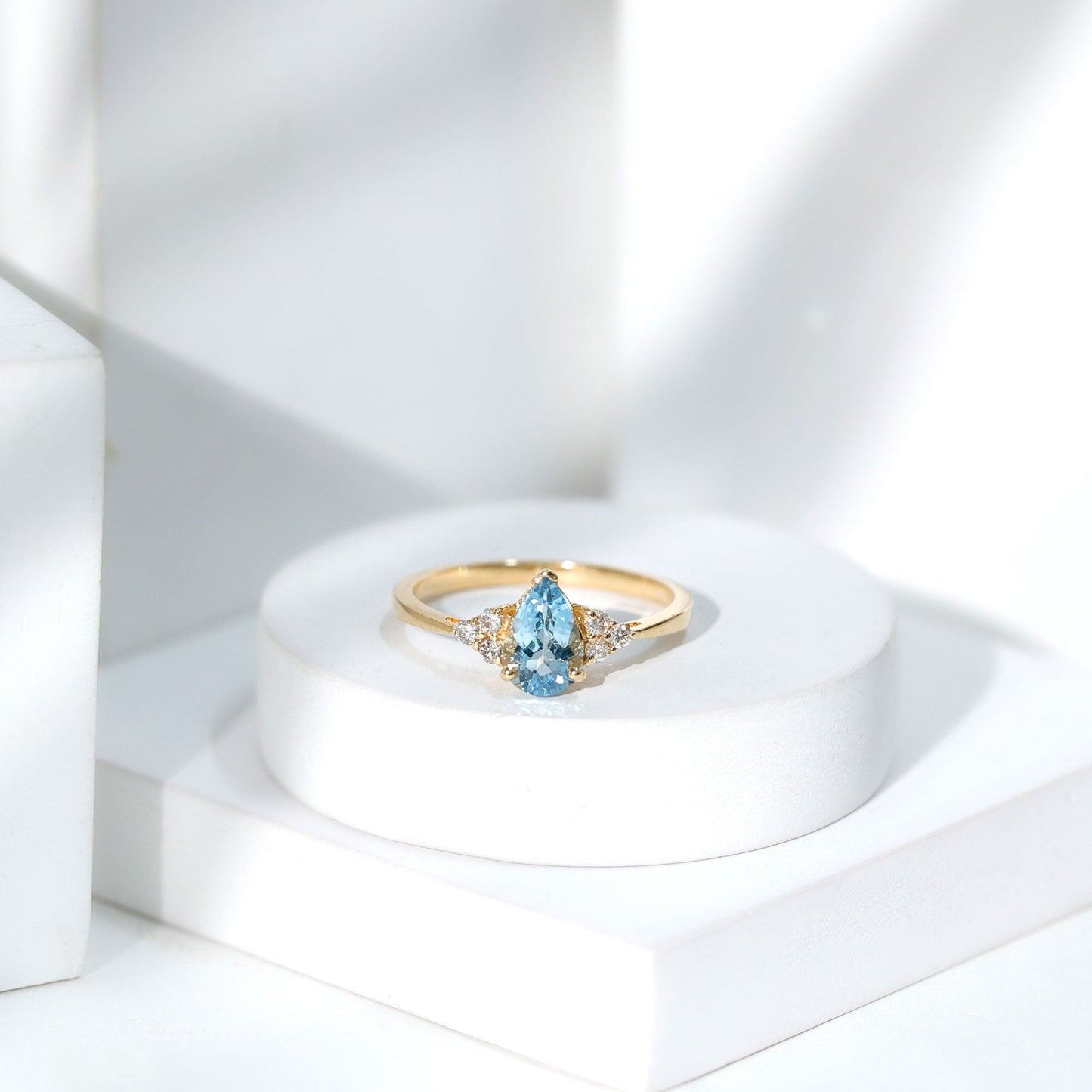 1 Carat Aquamarine Pear Engagement Ring with Diamond Trio