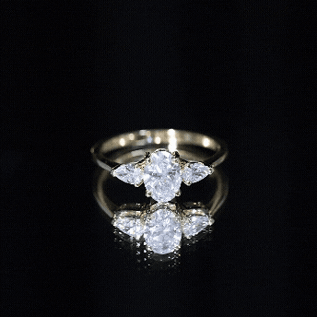 Oval and Pear Cut Moissanite Three Stone Engagement Ring