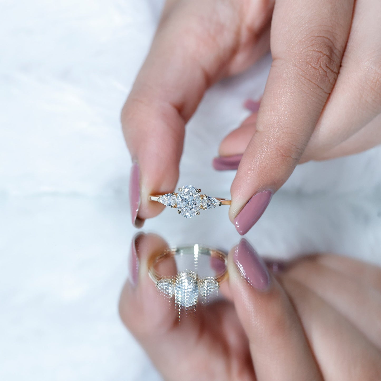 Oval and Pear Cut Moissanite Three Stone Engagement Ring