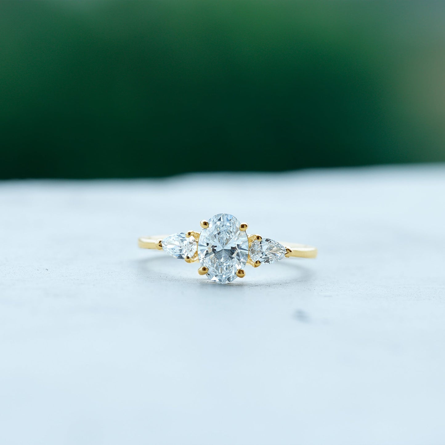 Oval and Pear Cut Moissanite Three Stone Engagement Ring