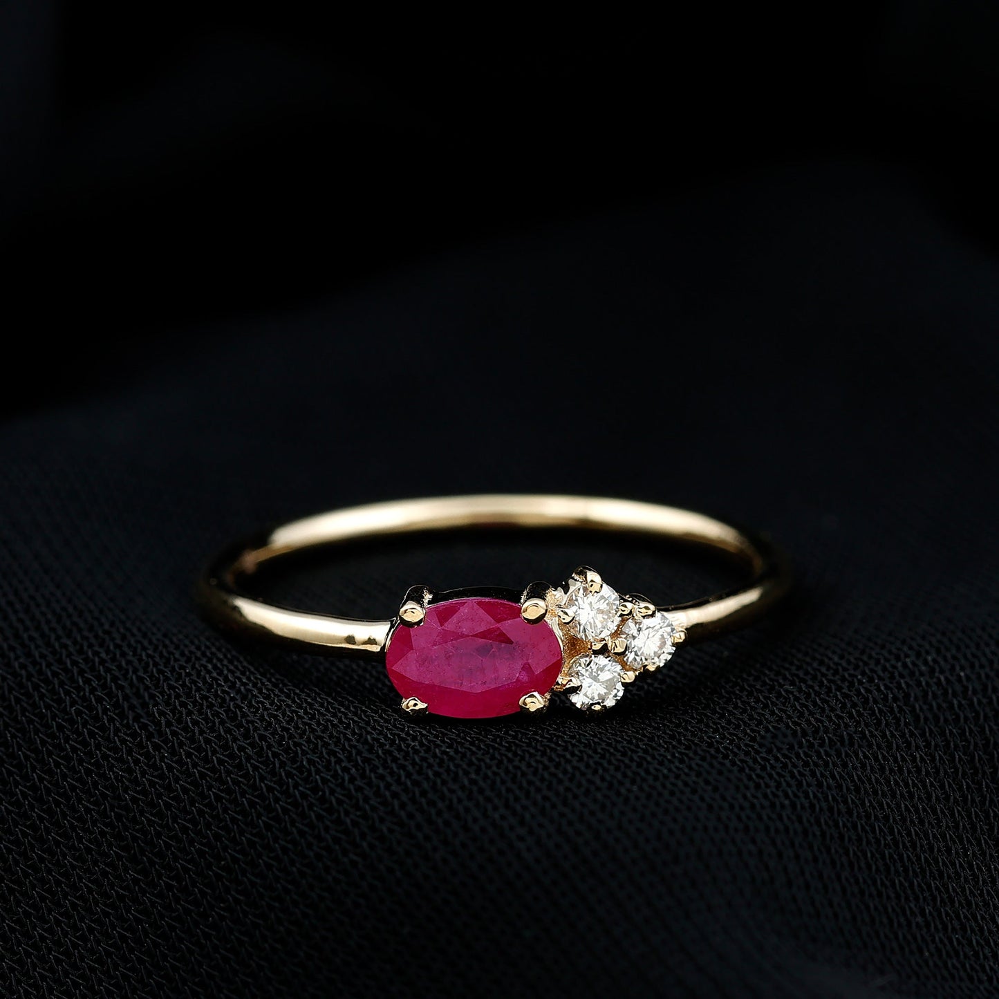 East West Style 0.6 Carat Oval Ruby Promise Ring with Diamond Trio