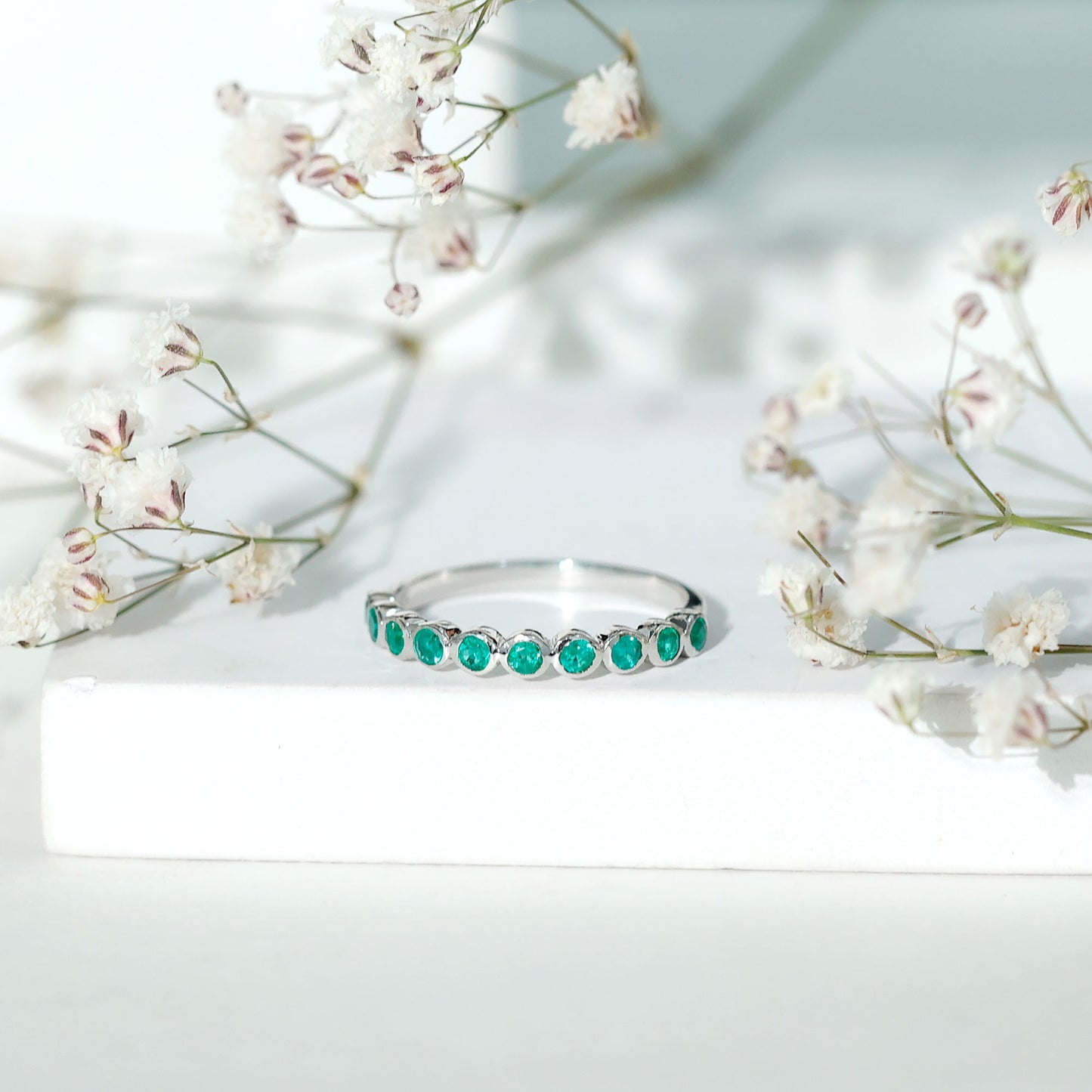 Natural Emerald Half Eternity Ring in Bezel Set