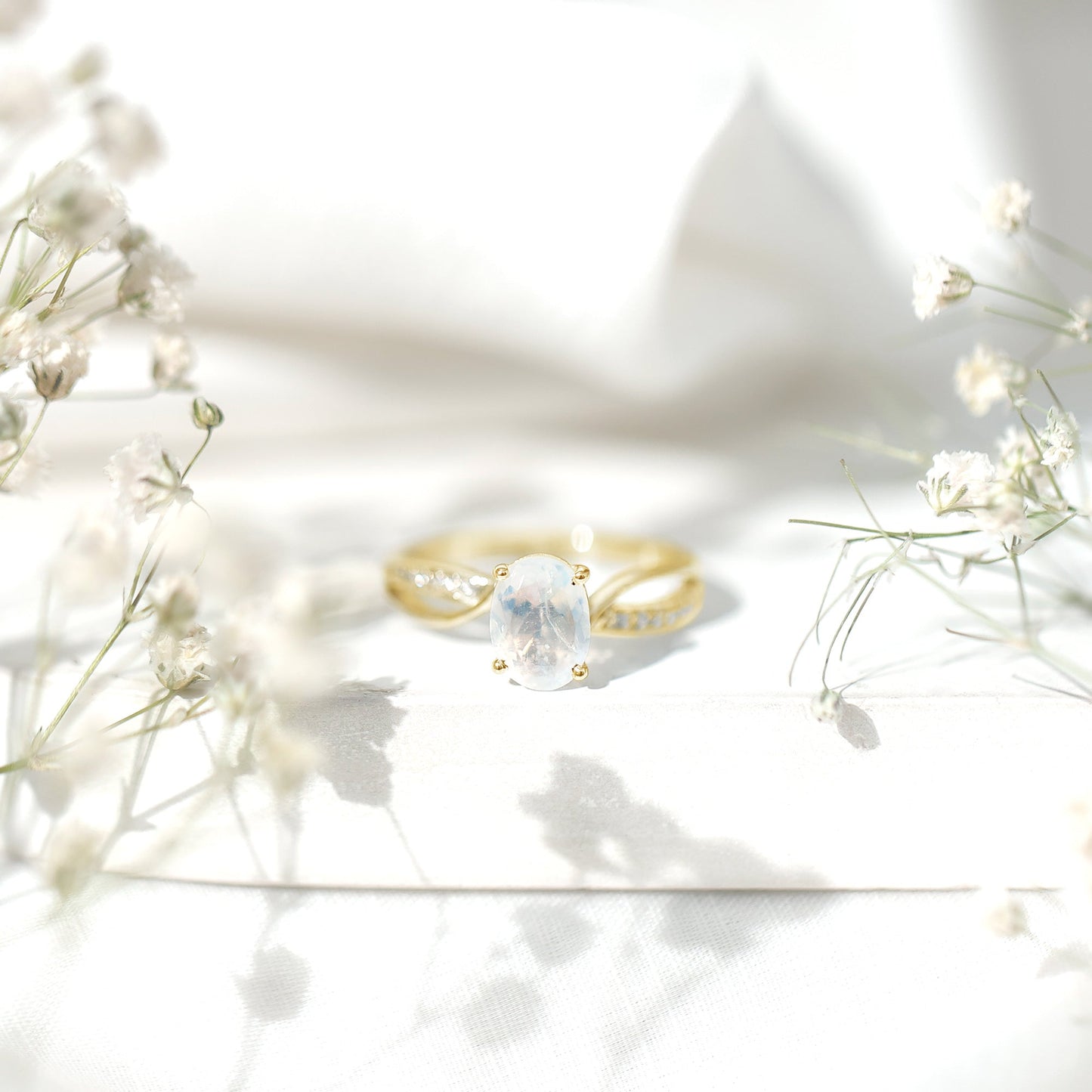 Oval Moonstone Infinity Engagement Ring with Diamond