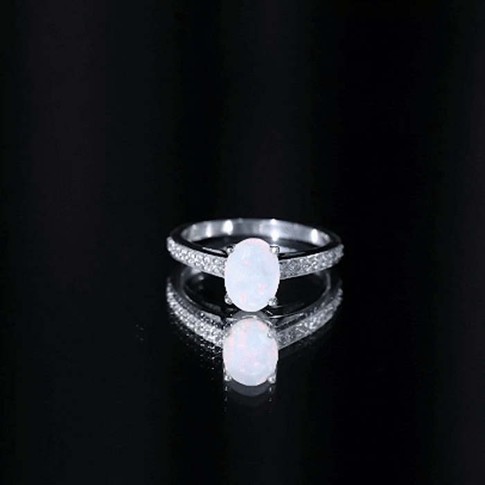 Natural 1.2 Carat Ethiopian Opal Oval Engagement Ring with Diamond Side Stones