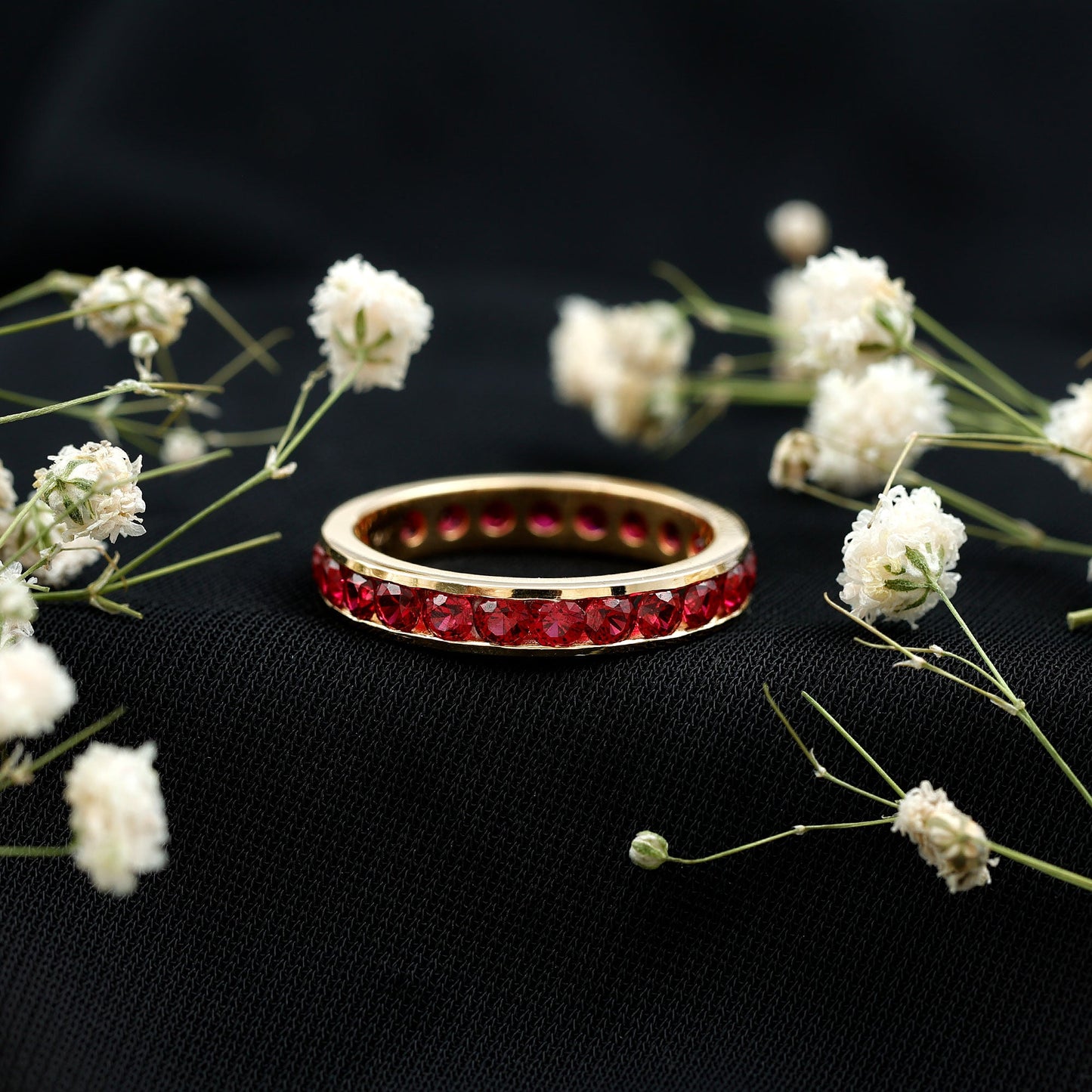 Round Created Ruby Full Eternity Ring in Channel Setting