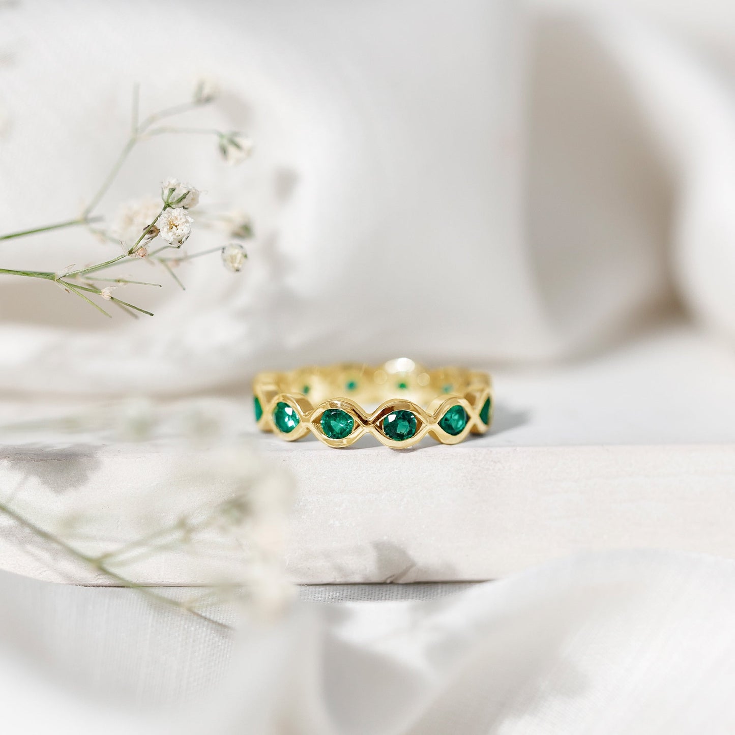 Certified Lab Grown Emerald Infinity Twisted Eternity Ring