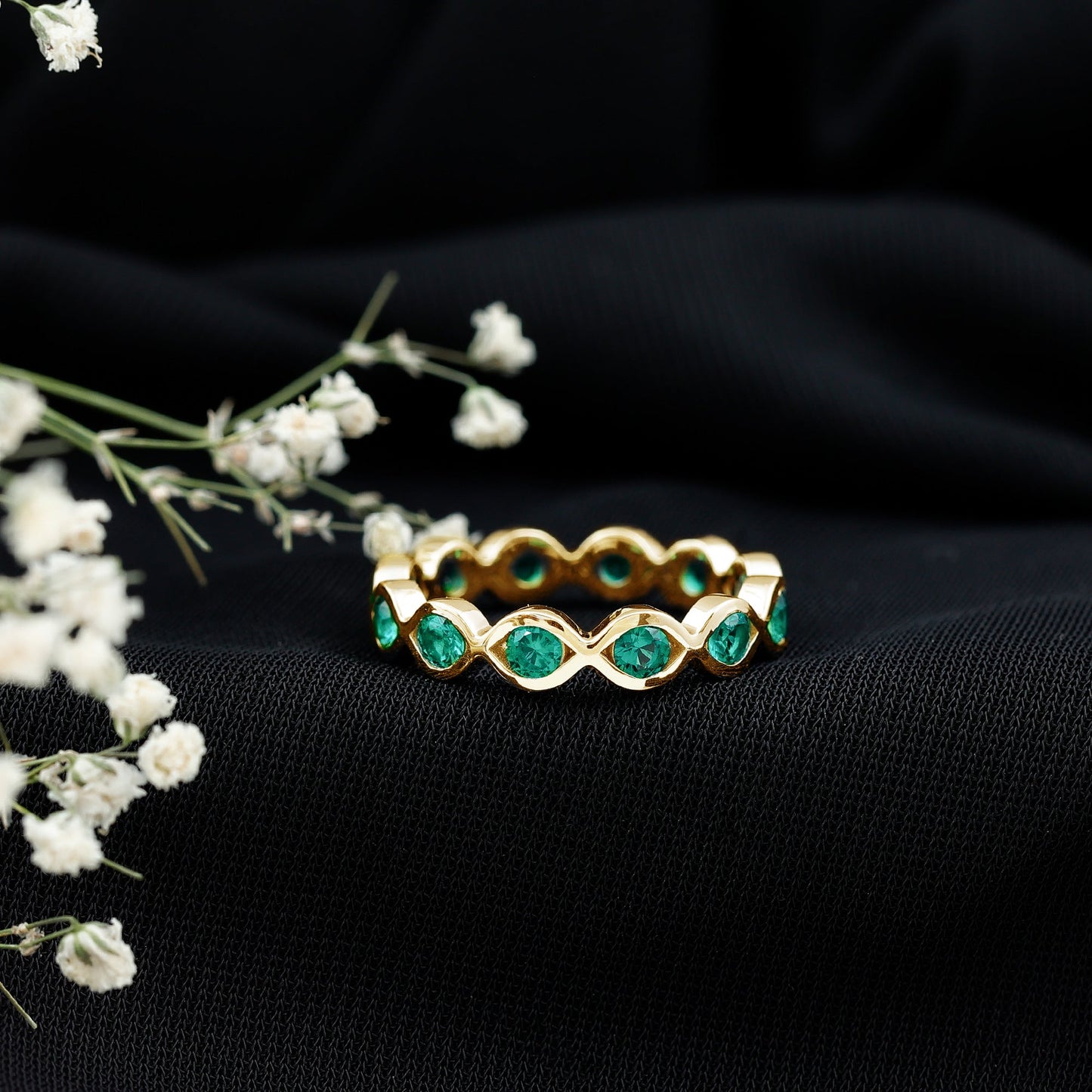 Certified Lab Grown Emerald Infinity Twisted Eternity Ring