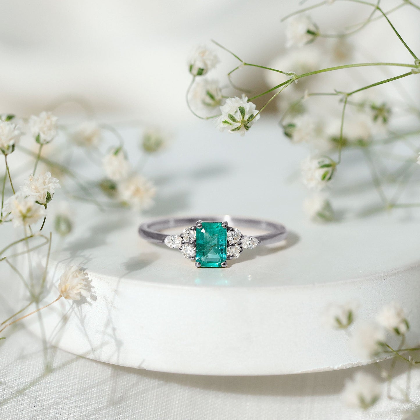 Emerald Cut Emerald Engagement Ring with Diamond Trio
