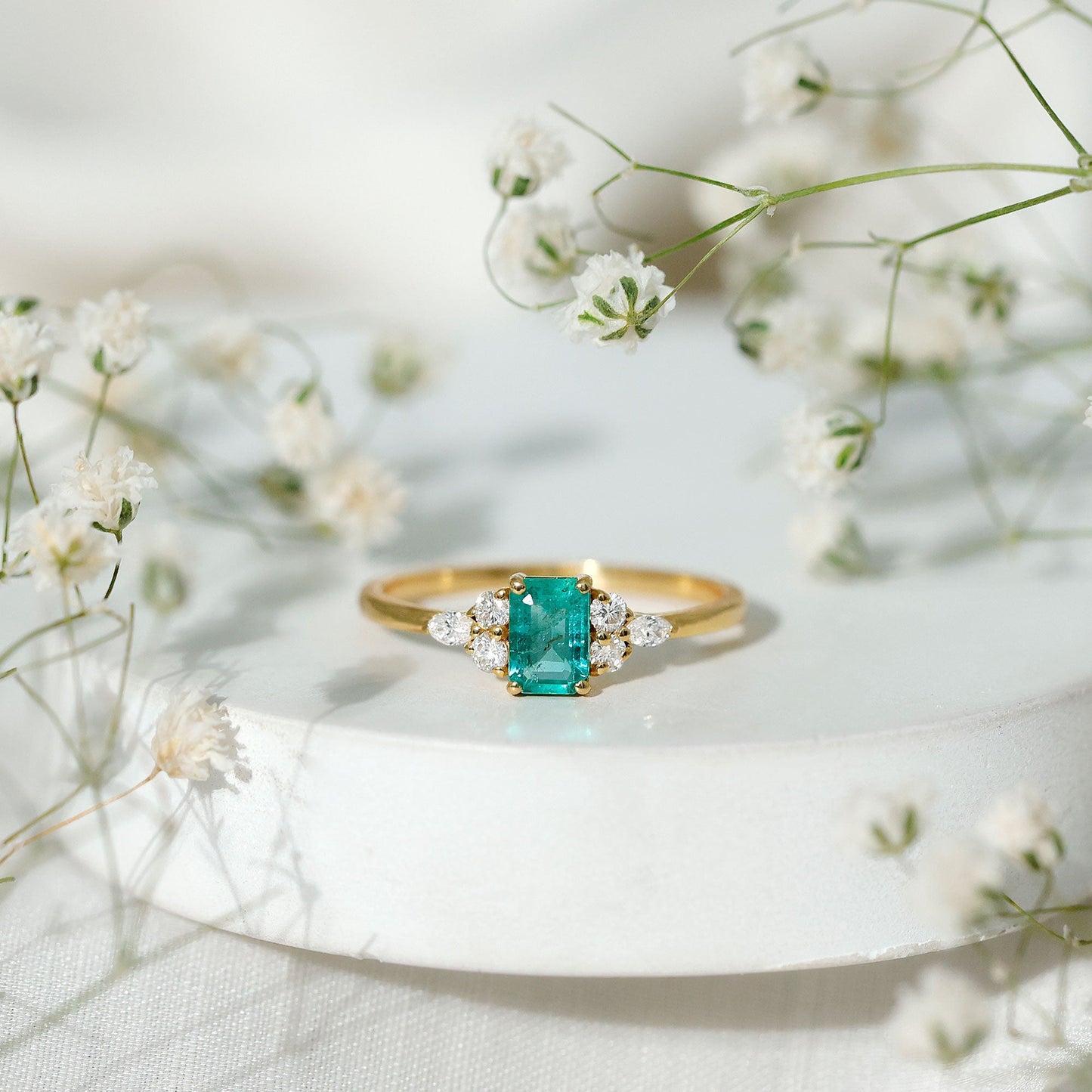 Emerald Cut Emerald Engagement Ring with Diamond Trio