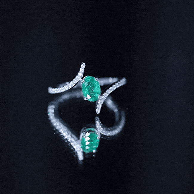 Oval Shaped Emerald Bypass Engagement Ring with Diamonds