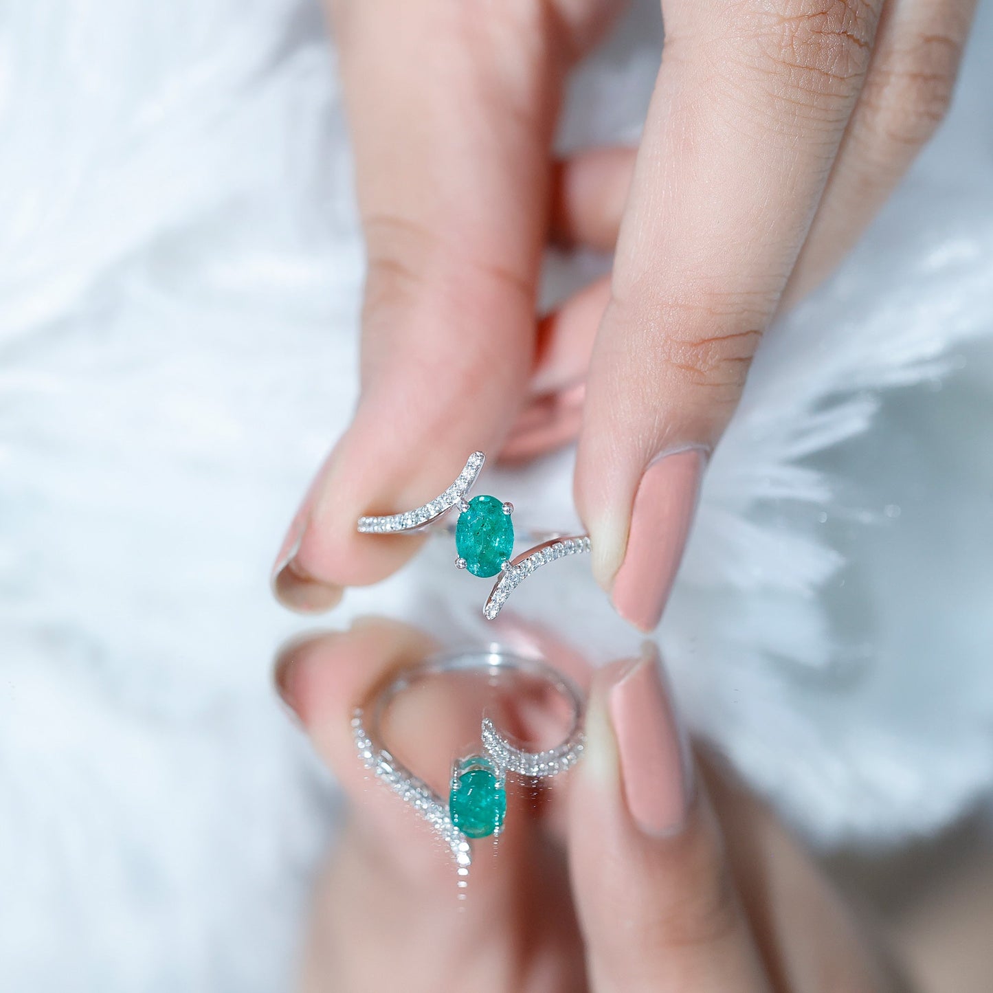 Oval Shaped Emerald Bypass Engagement Ring with Diamonds