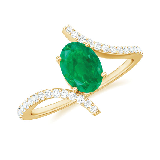 Oval Shaped Emerald Bypass Engagement Ring with Diamonds
