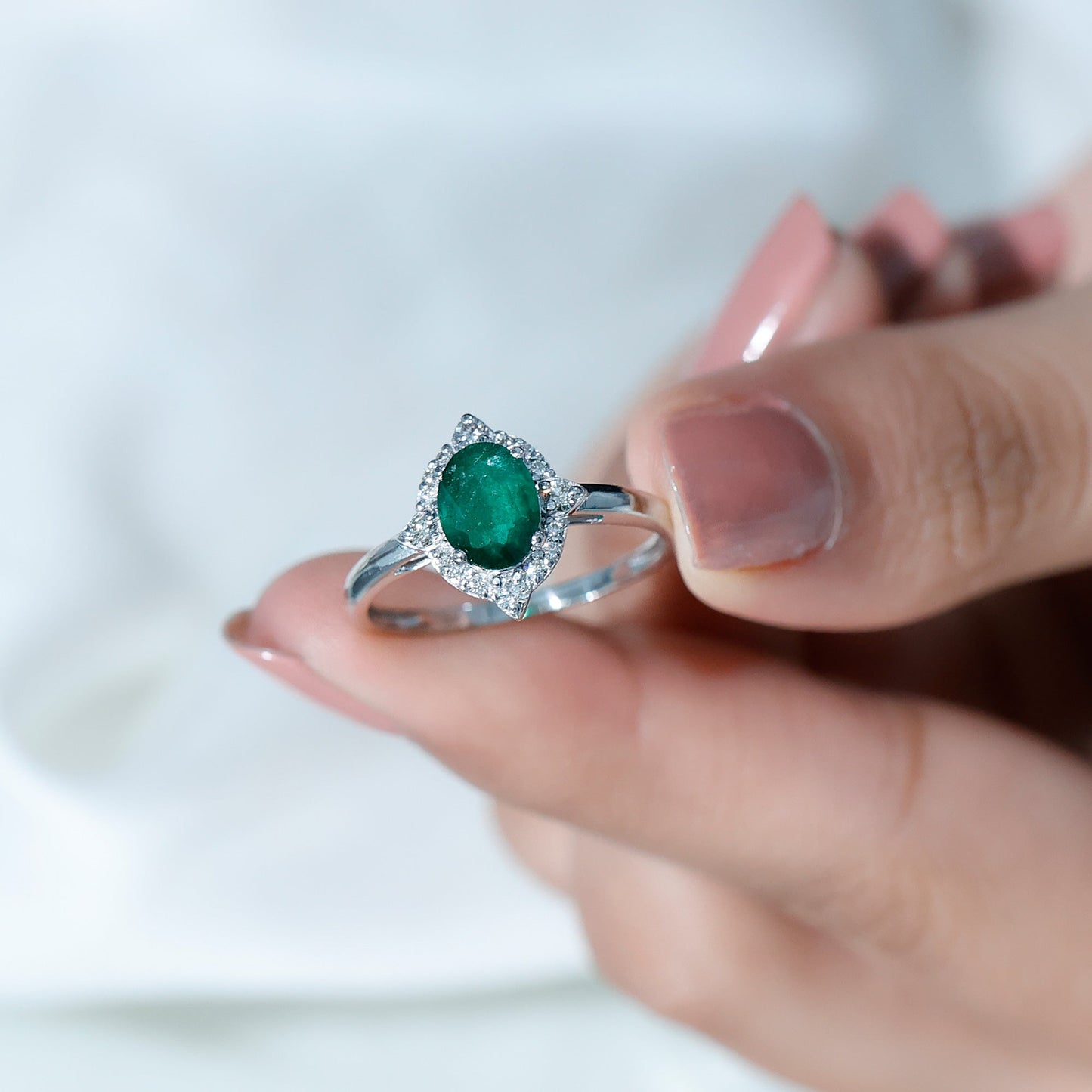 Vintage Looking Emerald Oval Engagement Ring with Diamond Halo